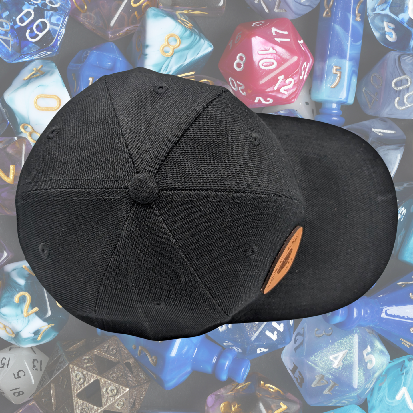 Top view black baseball style hat with round leather patch on the right side. Laser engraved onto the patch is a D20 rolled to a 1, critical fail. Above the d20 is the word Sarcasm and below the d20 is +5.