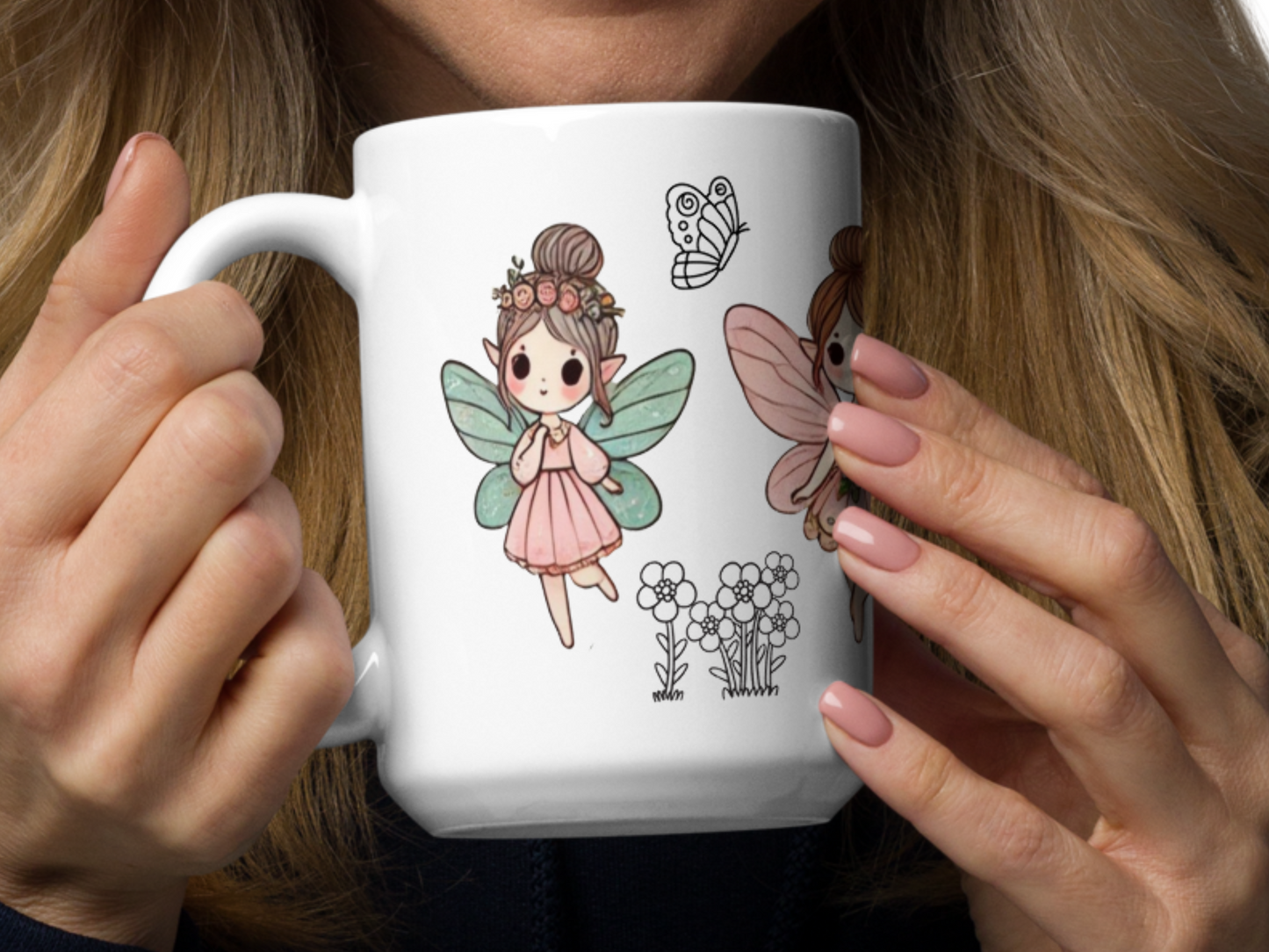 Women holding ceramic fairy coffee mug in her hands.