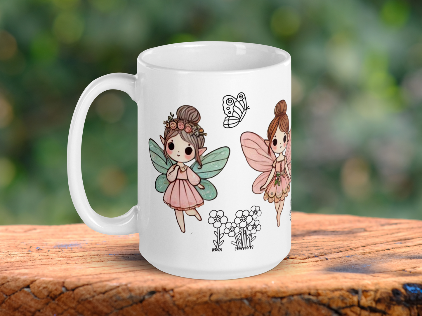 White ceramic fairy mug with handle to the left. On the left side you see a walking fairy with blue butterfly outspread wings, a pink dress, light brown hair in a bun with flowers, and pointed ears. To the right is the fairy with outspread pink butterfly wings, pink dress, and brunette hair in a bun. Between the fairies is the outline of a flying butterfly and a bunch of daisies.