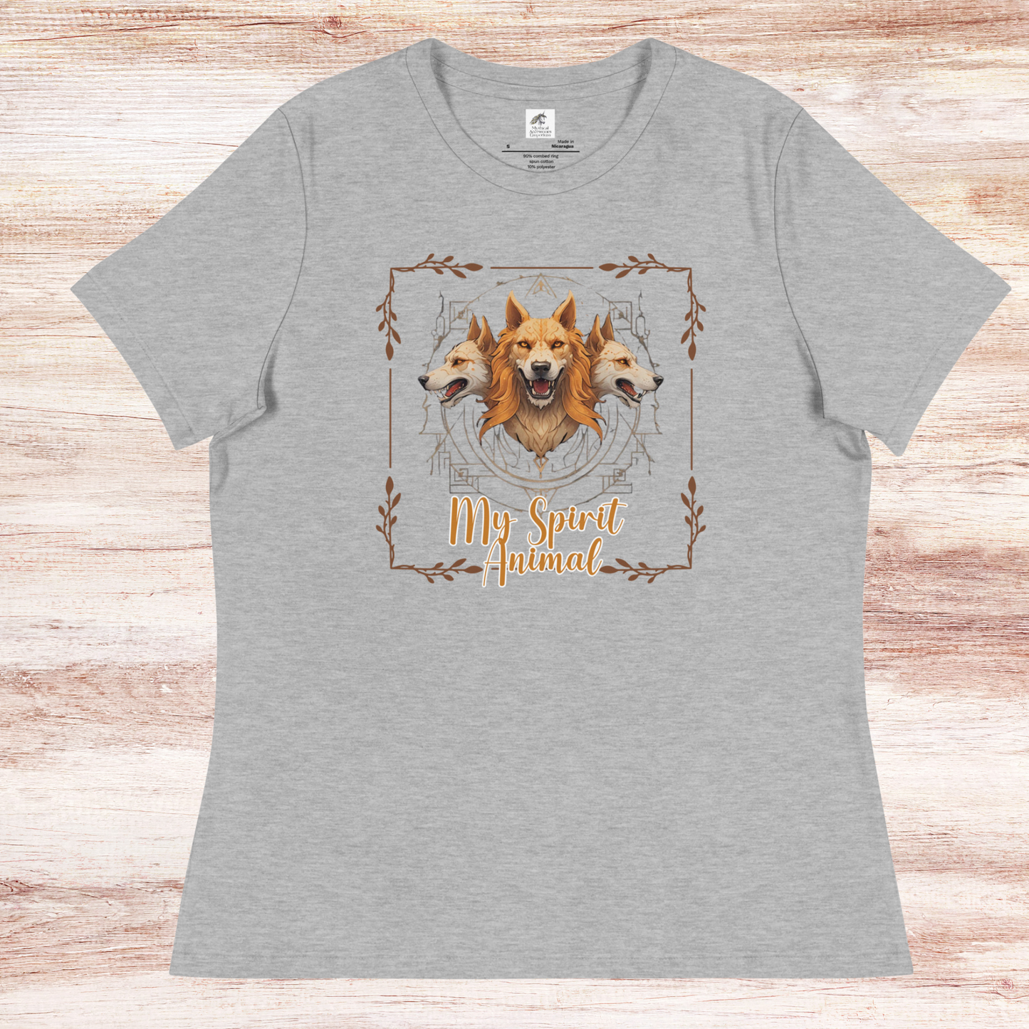 My Spirit Animal Cerberus Women's Graphic Tee, flat front View athletic heather t shirt. A three headed guardian of the underworld in golden browns with jaws open to display canines. Below the hellhound is my spirit animal