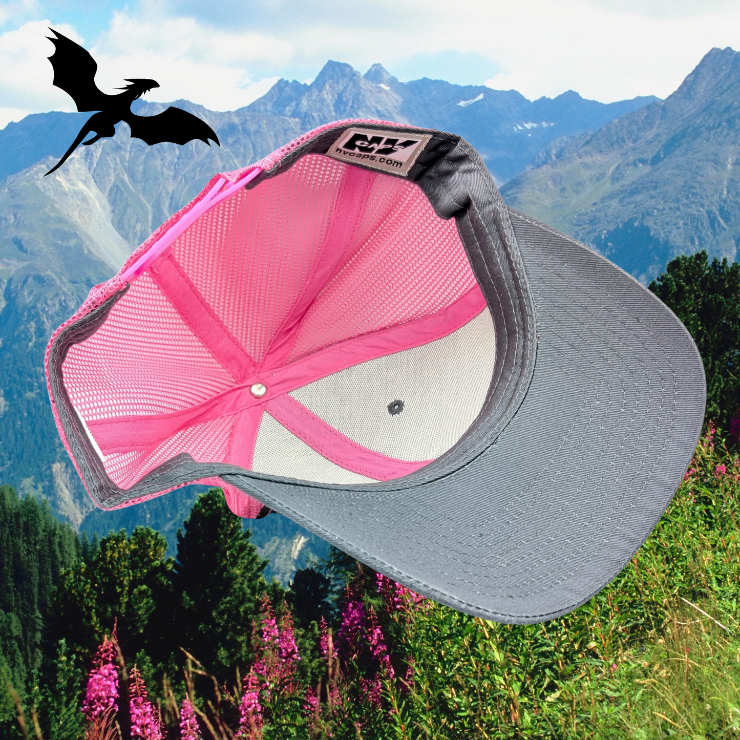 Inside view Grey front with pink mesh and pink stitching, snapback trucker hat. Montana Made Leather laser engraved patch. Inside a circle is a flying dragon, above the dragon is the word MAMA, and below is the text DRAGON. Gift for mom, mother's day gift