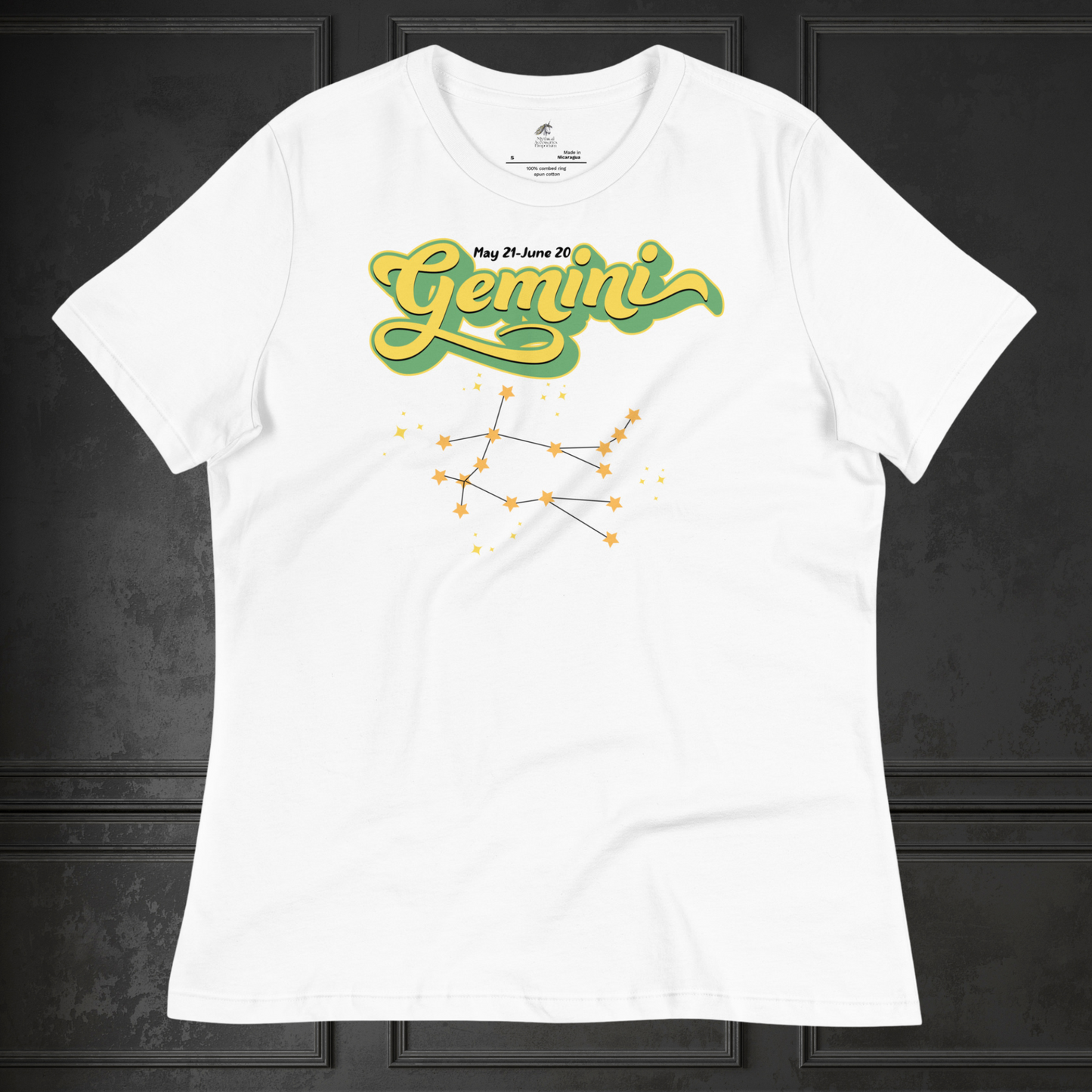 Front view of flat lay white astrology women's Gemini Tee. This Astrology T-Shirt has the word Gemini in large lemon yellow script shadowed in bright green for a 3-D effect. Above this it Says May 21-June 20. Under Gemini is the star constellation with yellow stars connected by a black line and yellow smaller stars surrounding this. The perfect May or June Birthday Gift for Her or yourself.