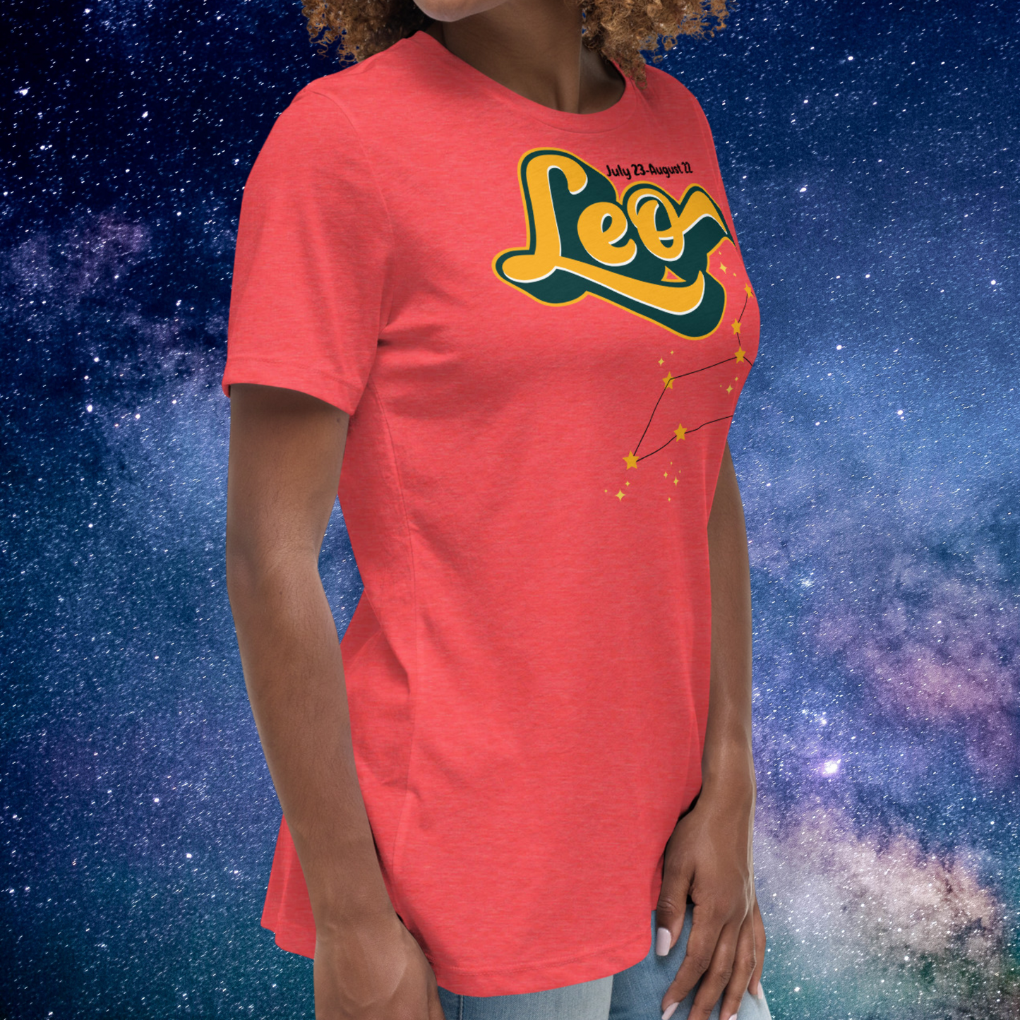 Right side view of model wearing Heather Red women's Leo Tee. This astrology Leo T-Shirt has the word Leo in large yellow script shadowed in deep green for a 3-D effect. Above this it Says July 23-August 22. Under Cancer is the zodiac star constellation with yellow stars connected by a black line and lighter yellow smaller stars surrounding this. The perfect July or August Birthday Gift for Her or yourself.
