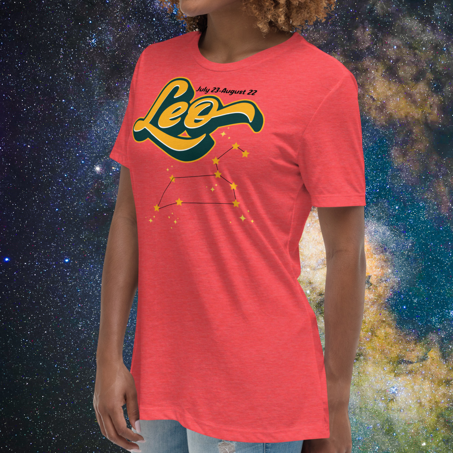 Left side view of model wearing Heather Red women's Leo Tee. This astrology Leo T-Shirt has the word Leo in large yellow script shadowed in deep green for a 3-D effect. Above this it Says July 23-August 22. Under Cancer is the zodiac star constellation with yellow stars connected by a black line and lighter yellow smaller stars surrounding this. The perfect July or August Birthday Gift for Her or yourself.