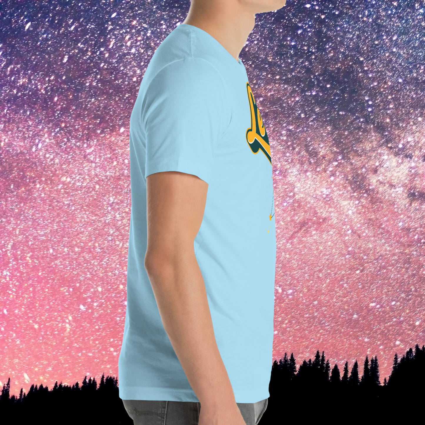 Right side view of model wearing Ocean Blue men's Leo Tee. You can see the short sleeves end mid upper arm, the hem ends at the hips, and there is a crew neck. The perfect July or August Birthday Gift for him or yourself.