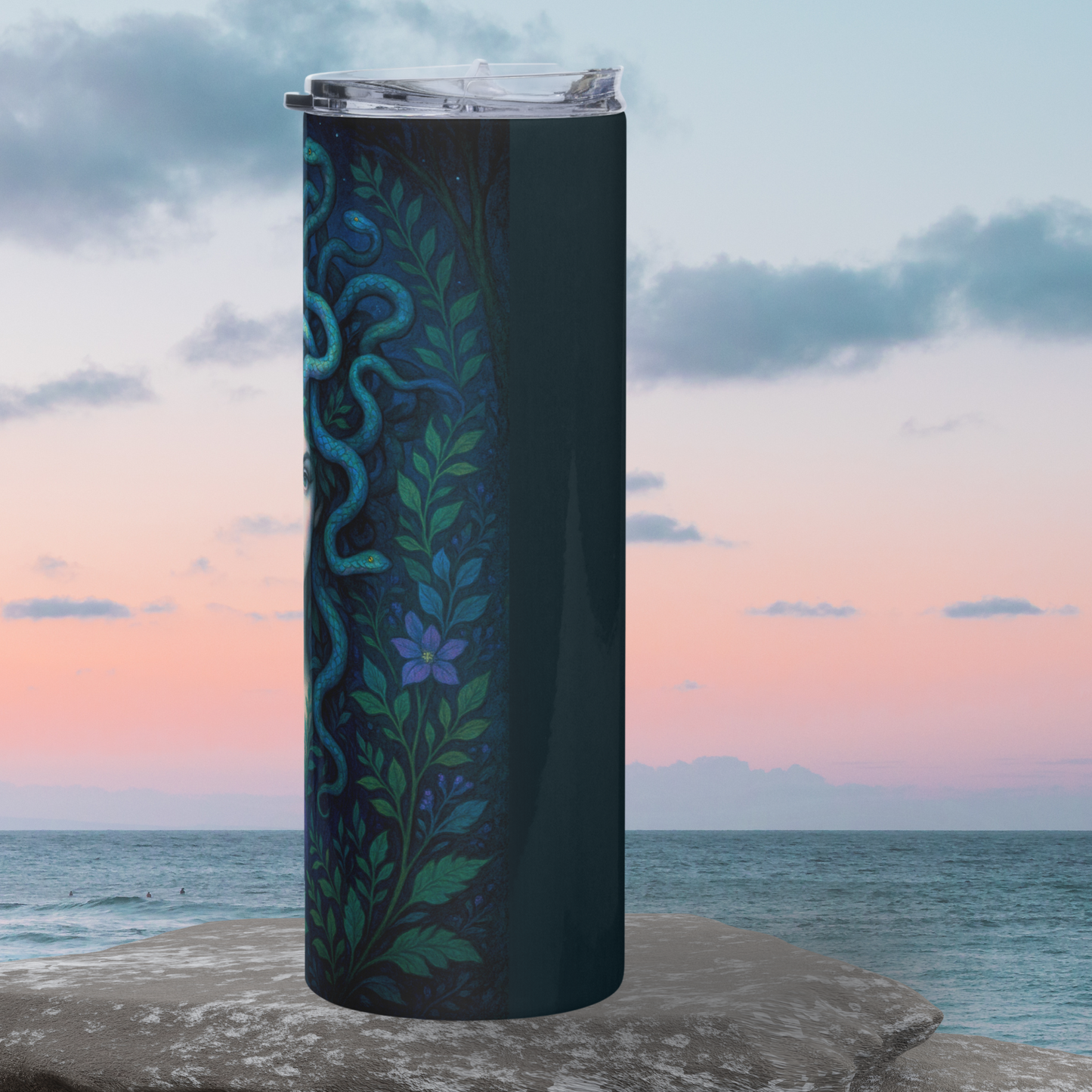 Medusa Steel Tumbler right side. Right side of Medusa's hair snakes are visible. You see vines and purple flowers going up the side of the tumbler. Bookish Merch
