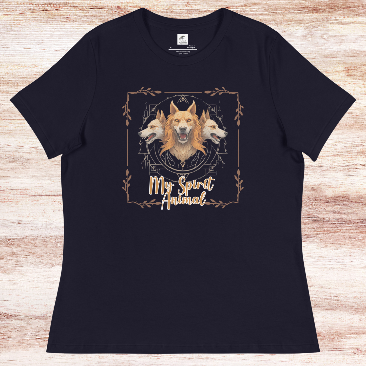 My Spirit Animal Cerberus Women's Graphic Tee, flat front View navy t shirt. A three headed guardian of the underworld in golden browns with jaws open to display canines. Below the hellhound is my spirit animal