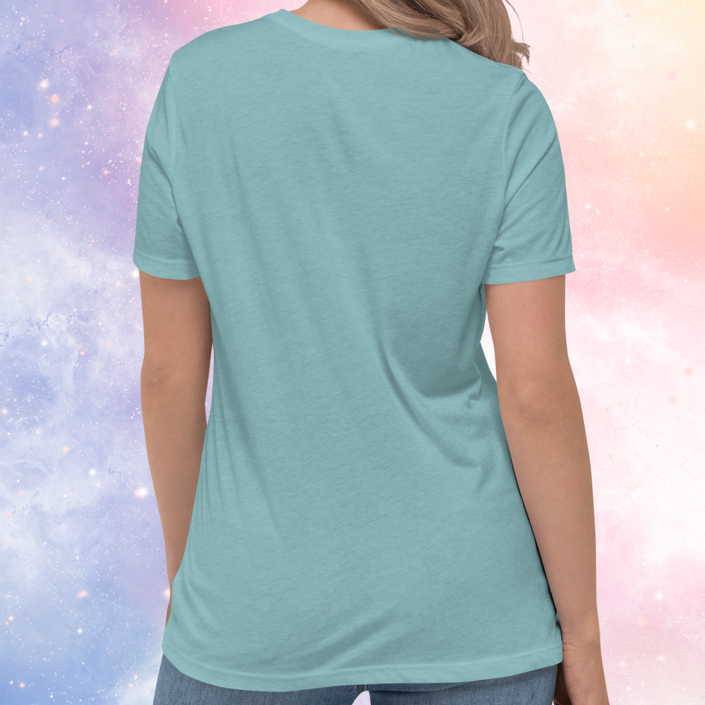 Back view of model wearing Heather blue lagoon women's Scorpio Tee. No graphic on back of shirt. You can see the crew neck neckline, the short sleeves come to mid upper arm, and the hem falls past the hip of the model. The perfect October or November Birthday Gift for her or yourself.