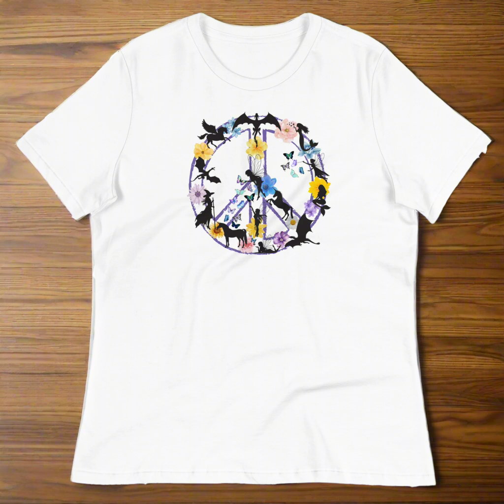 70s Vintage Peace Sign Women's white T-Shirt Front View laying on a wooden counter. Purple Peace sign filled in with dragons, mermaids, fairies, unicorns, pegasi, witches, flowers, and butterflies.