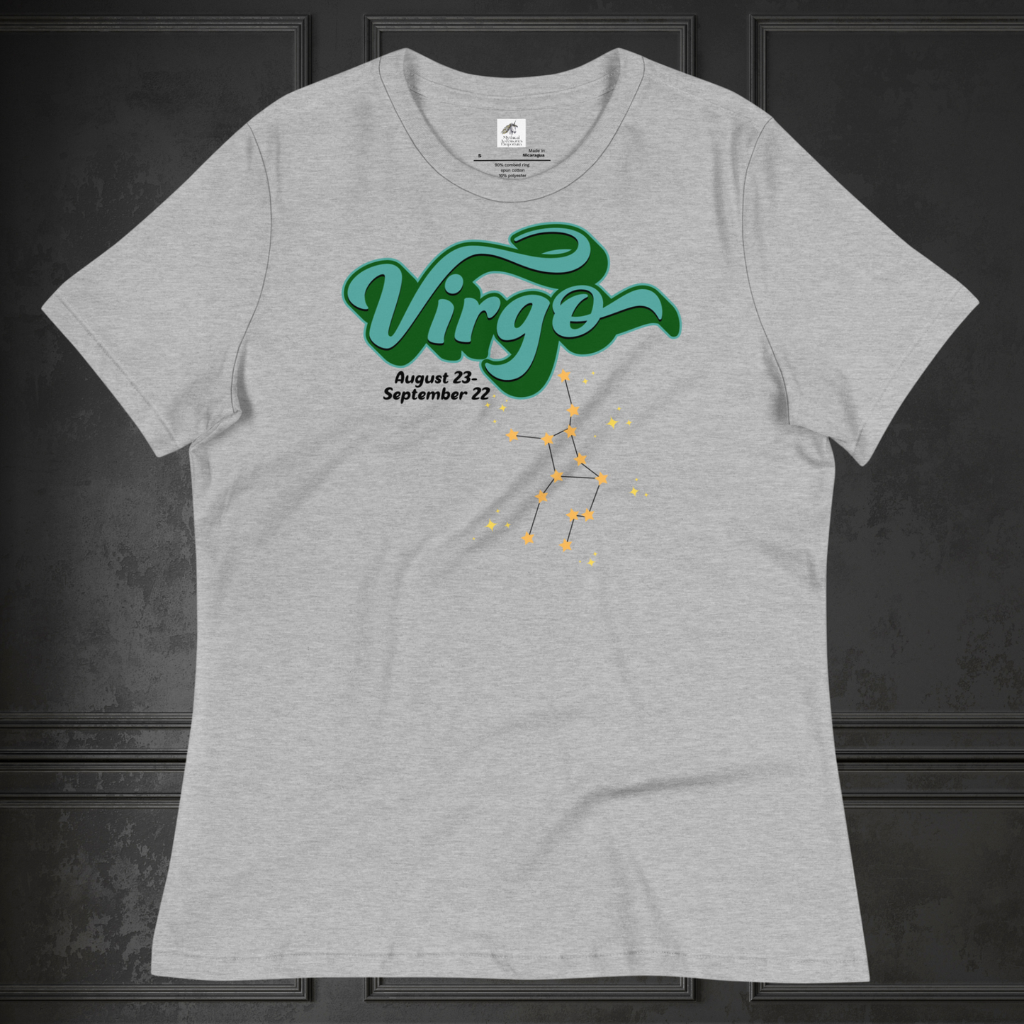 Front view of flat athletic heather (grey) women's Virgo Tee. This astrology Virgo T-Shirt has the word Virgo in large turquoise script shadowed in deep green for a 3-D effect. Below this it Says August 23-September 22. Under Virgo is the zodiac star constellation with yellow stars connected by a black line and lighter yellow smaller stars surrounding this. The perfect August or September Birthday Gift for Her or yourself.