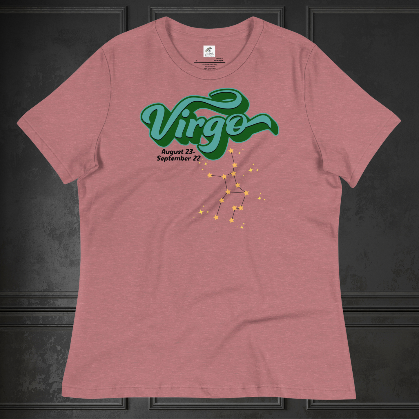 Front view of heather mauve flat women's Virgo Tee. This astrology Virgo T-Shirt has the word Virgo in large turquoise script shadowed in deep green for a 3-D effect. Below this it Says August 23-September 22. Under Virgo is the zodiac star constellation with yellow stars connected by a black line and lighter yellow smaller stars surrounding this. The perfect August or September Birthday Gift for Her or yourself.