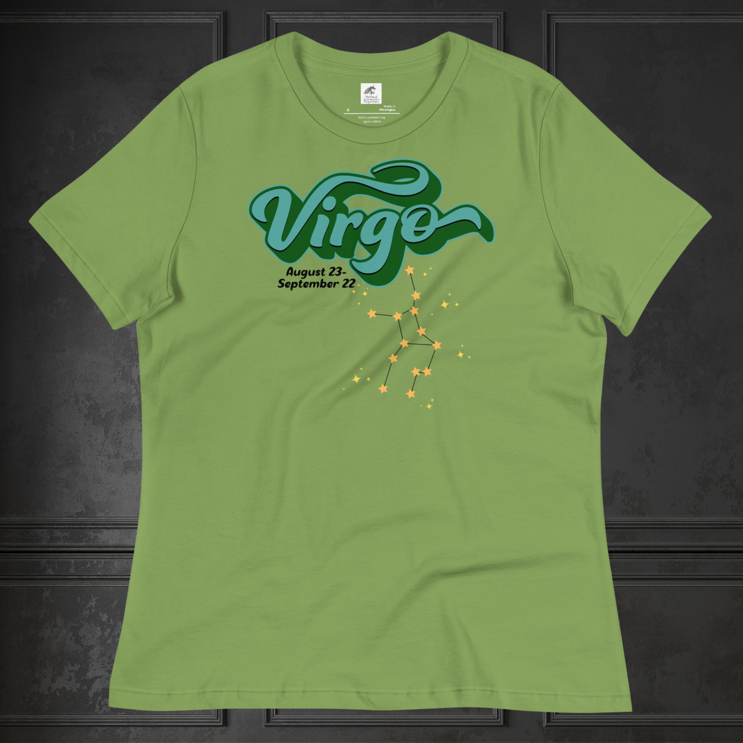 Front view of flat leaf green women's Virgo Tee. This astrology Virgo T-Shirt has the word Virgo in large turquoise script shadowed in deep green for a 3-D effect. Below this it Says August 23-September 22. Under Virgo is the zodiac star constellation with yellow stars connected by a black line and lighter yellow smaller stars surrounding this. The perfect August or September Birthday Gift for Her or yourself.