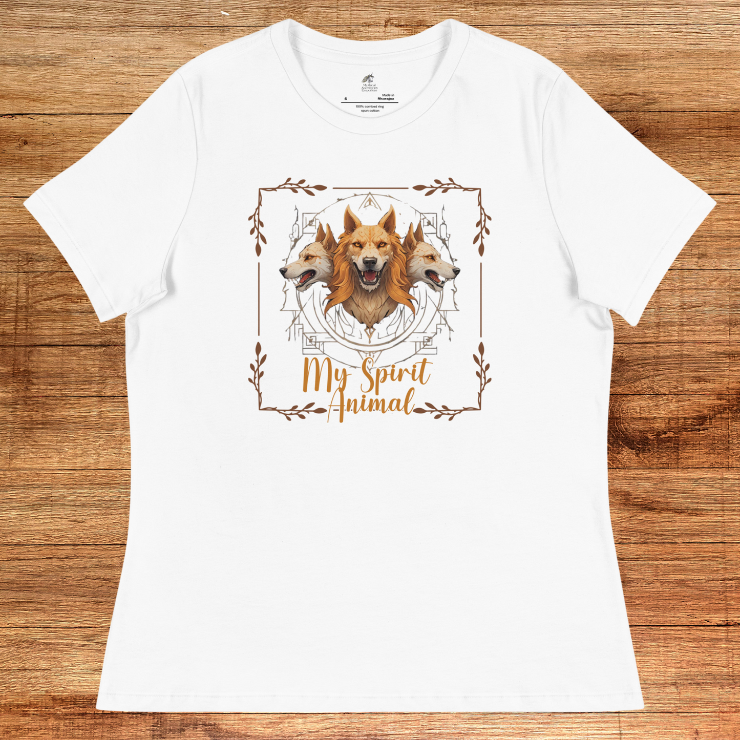 My Spirit Animal Cerberus Women's Graphic Tee, flat front View white t shirt. A three headed guardian of the underworld in golden browns with jaws open to display canines. Below the hellhound is my spirit animal