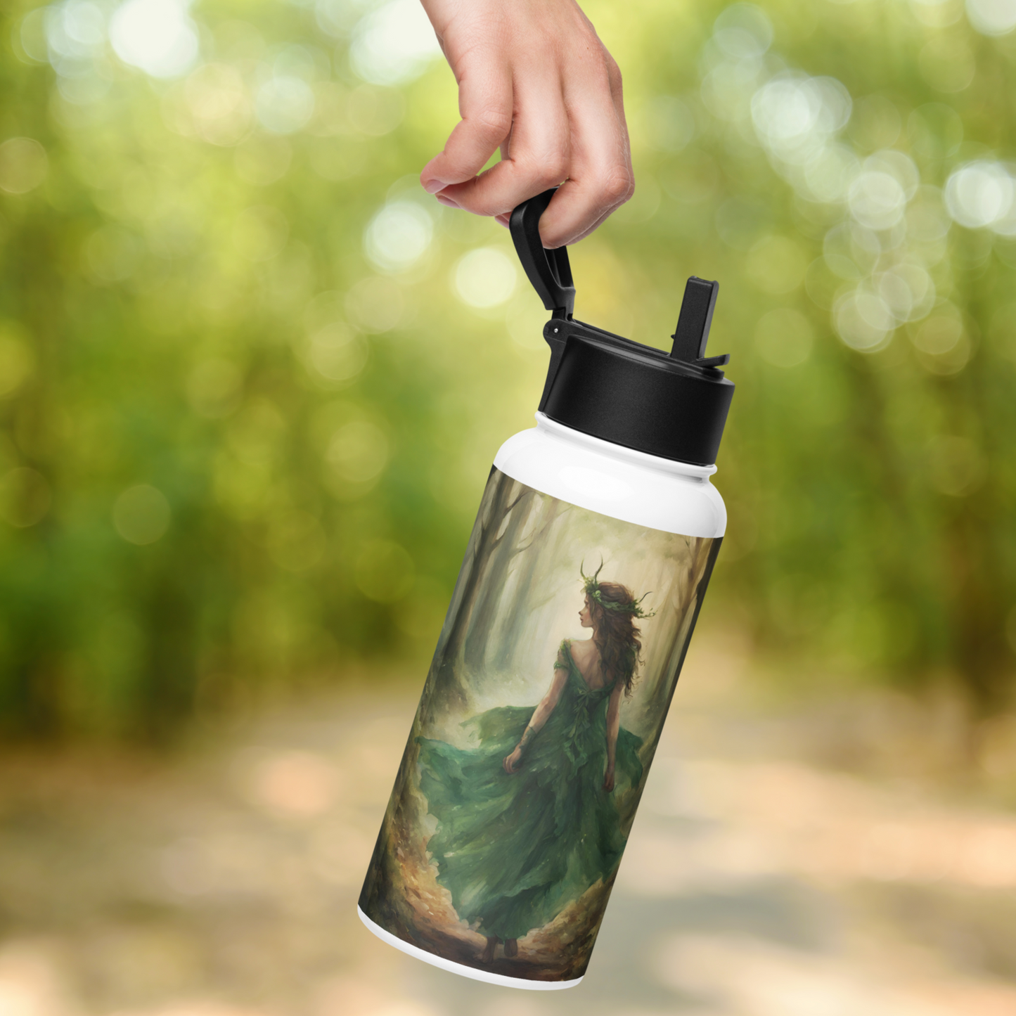 Stainless Steel water bottle held by the handle hanging from a hand.