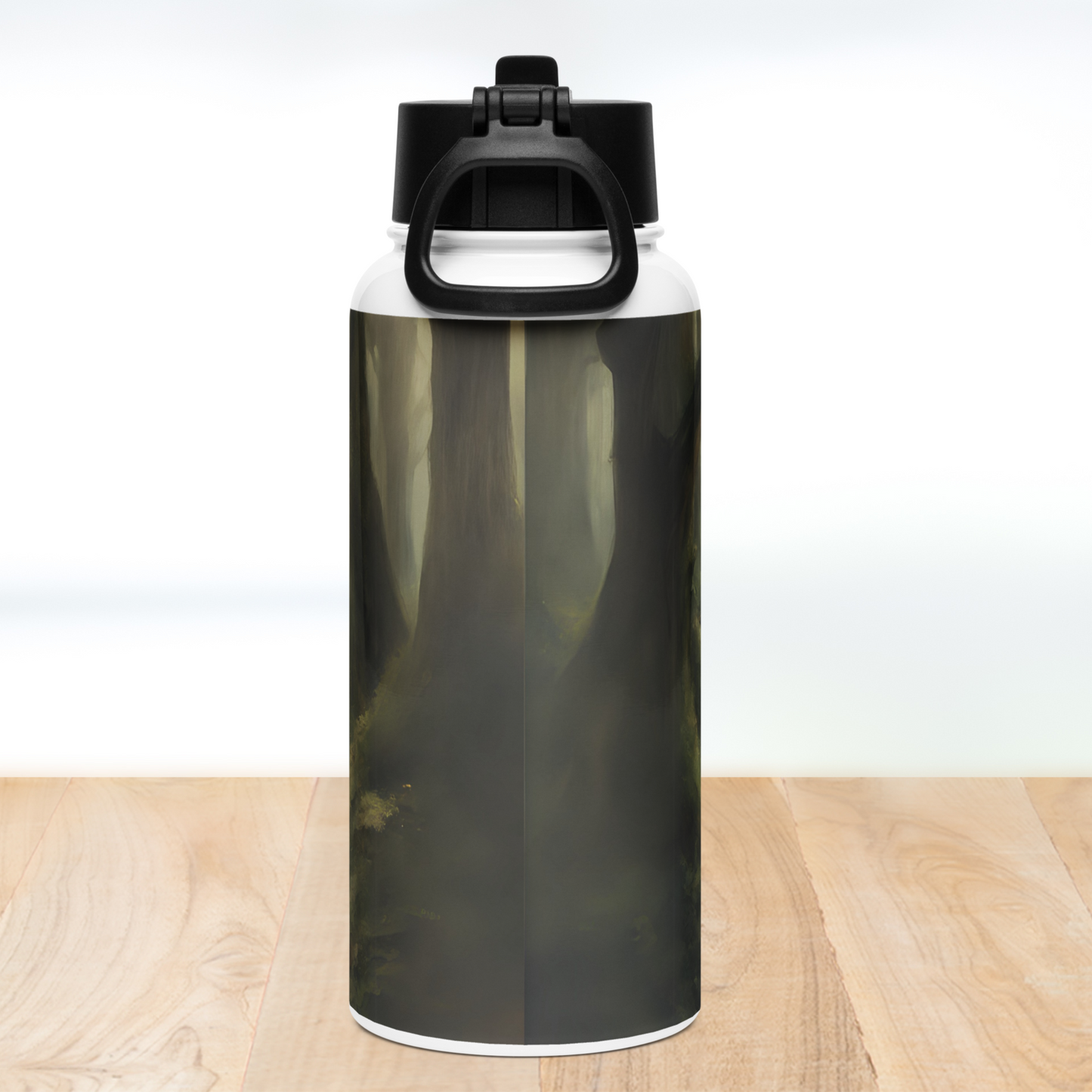 Back view of stainless steel tumbler. Black lid with handle down. You can see moody tree trunks rising up out of the ground.