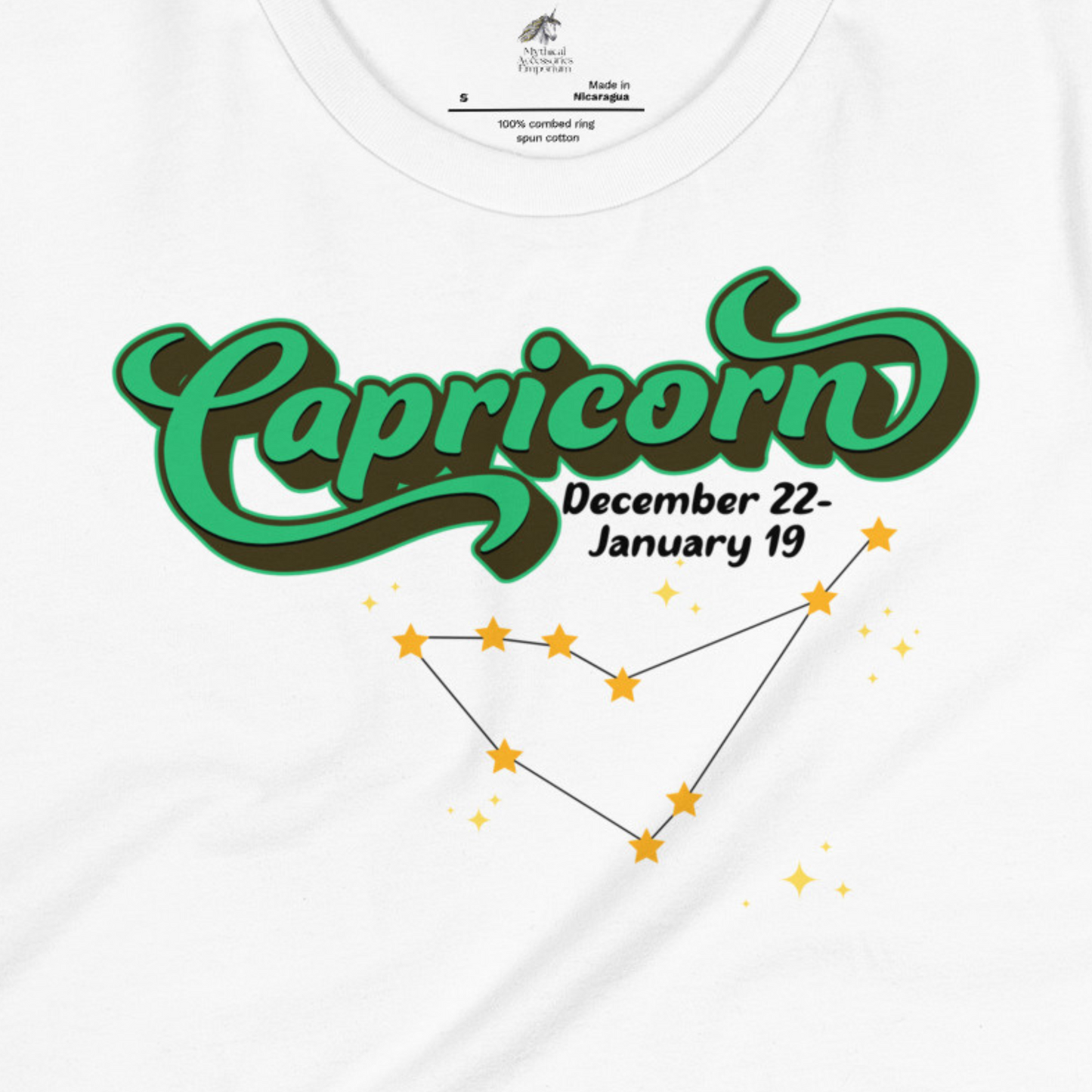 Up close front view of white women's Capricorn Tee. This astrology T-Shirt has the word Capricorn in a large green script shadowed in black for a 3-D effect. Below this it Says December 22-January 19. Under Capricorn is the zodiac star constellation with yellow stars connected by a black line and lighter yellow smaller stars surrounding this. The perfect December or January Birthday Gift for Her or yourself.