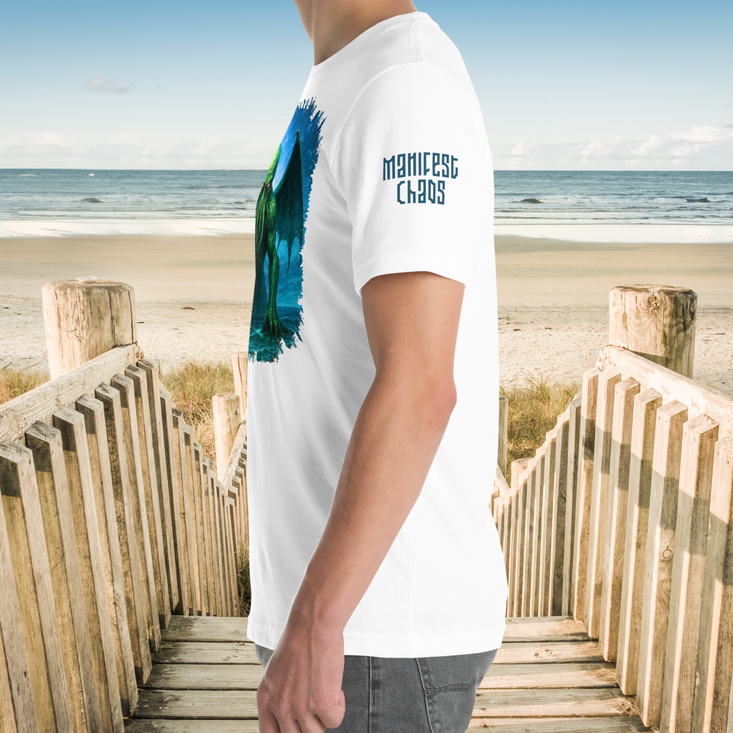 Cthulhu Men's White T-Shirt on Model. Short sleeve has the text Manifest Chao in deep grey blue.