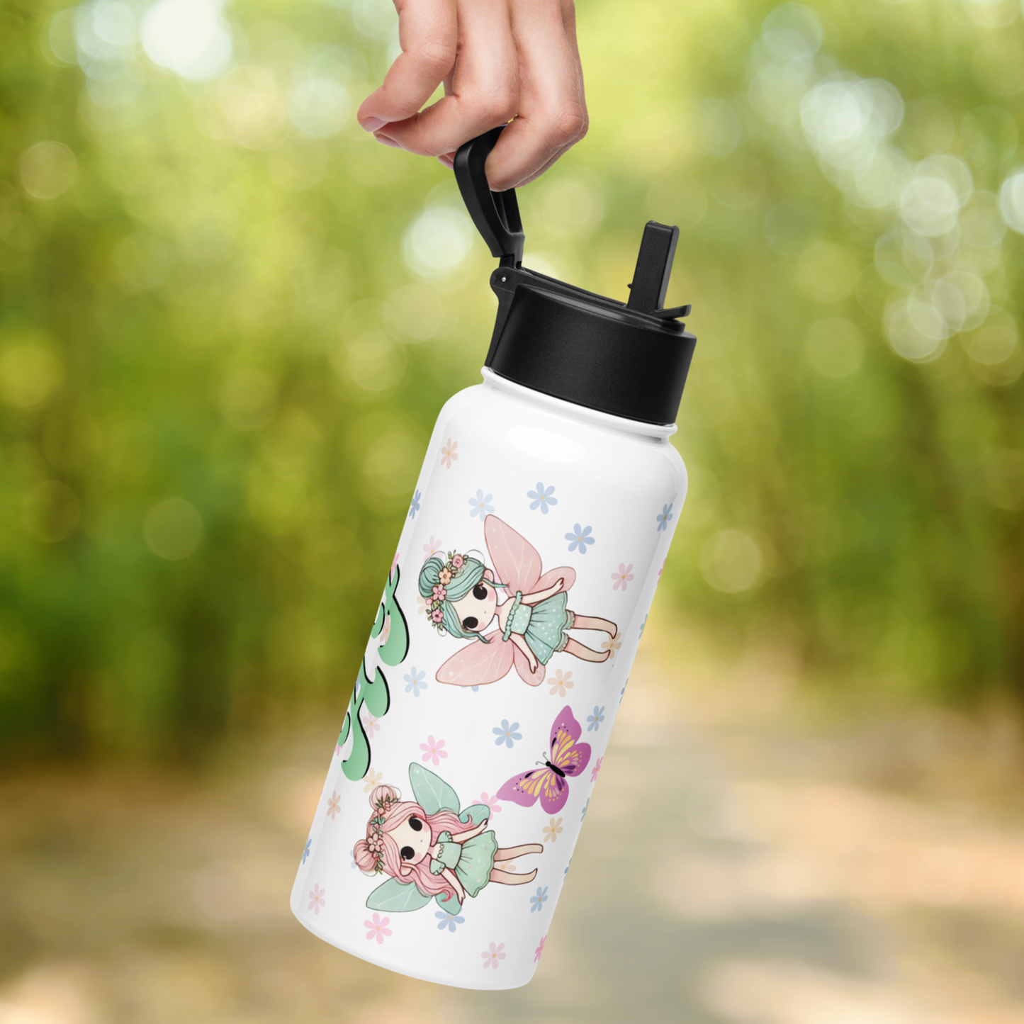 Fairy TUmbler held by handle hanging from a hand.