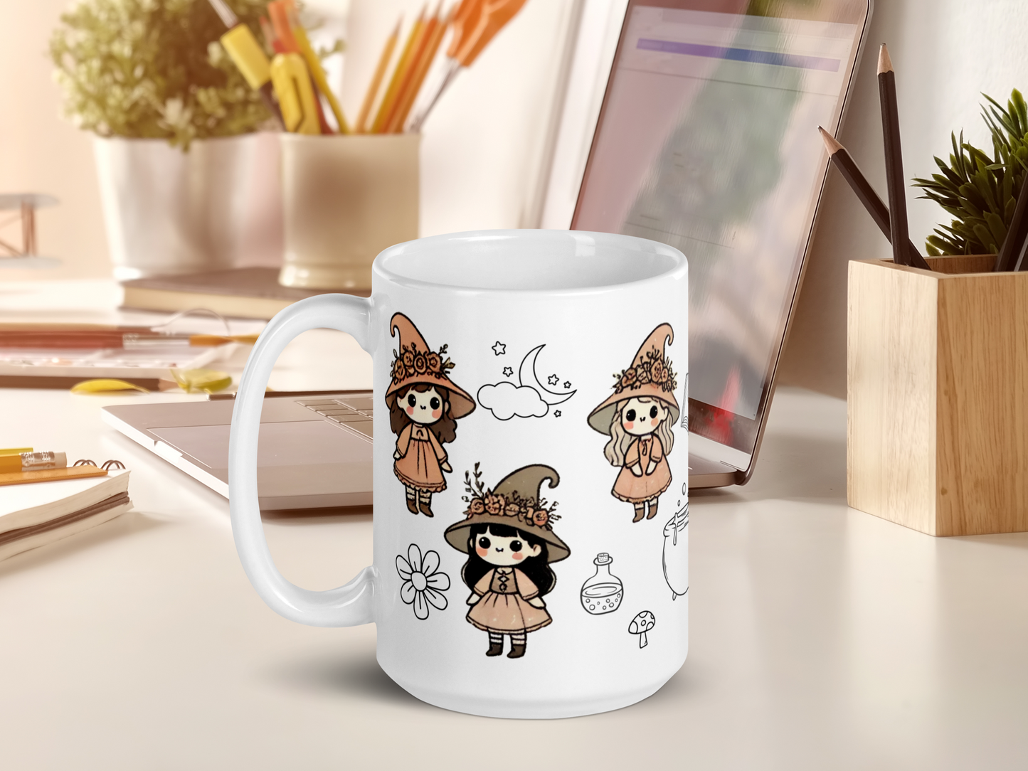 Vintage coven witch mug on a computer desk next to a laptop.