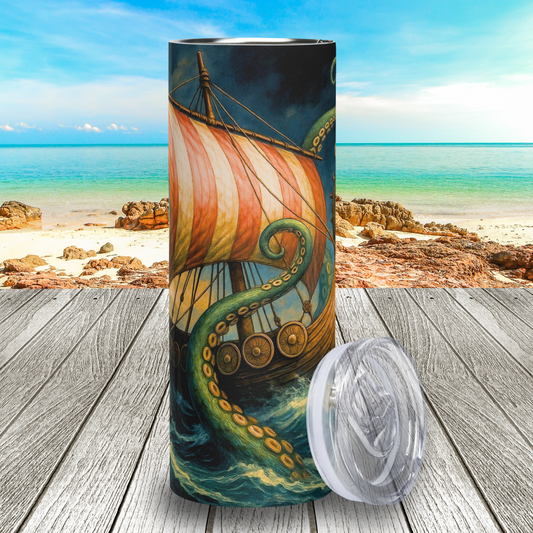 20 oz stainless steel tumbler with BPA free lid leaning against the right side, front view. The middle of the longship is visible with shields lining the wood side and a red and white striped sail above. Green Kraken tentacles rise up out of a storm tossed ocean to surround the ship. Behind the longship is a dark grey and blue storm cloud filled sky. Fantasy Viking Gifts