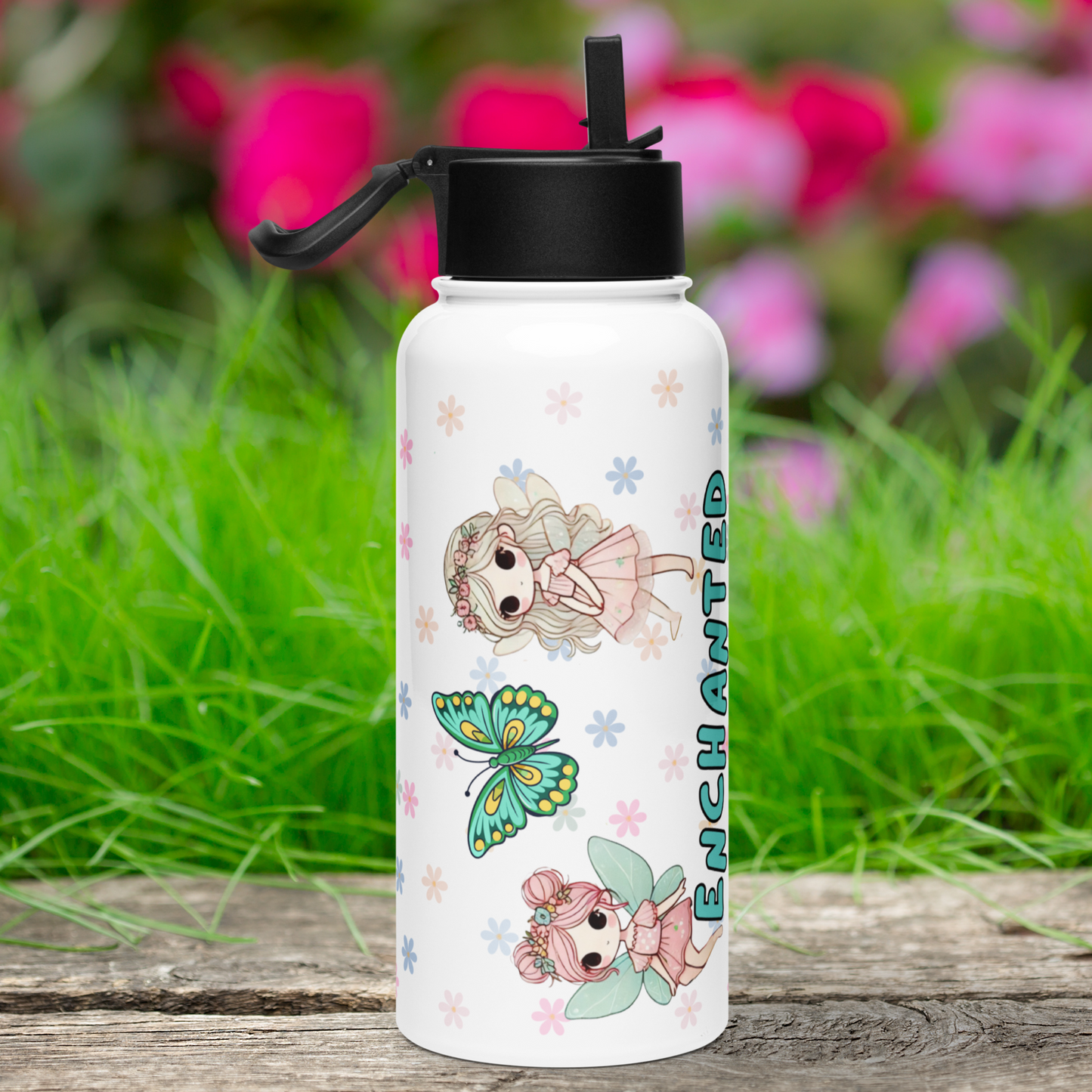 Left side view of Fairy Tumbler with black lid. Flip up straw is sticking up and handle is up to the left. At the top is a chibi Fairy with large eyes, long blonde hair, a pink flower crown, wings, pink dress, and her hands in front of her. To the bottom is a pink haired fairy with buns, blue wings, pink dress, and sitting on the beginning of the word enchanted. Between the fairies is a blue butterfly. Background is mini pastel daisies.
