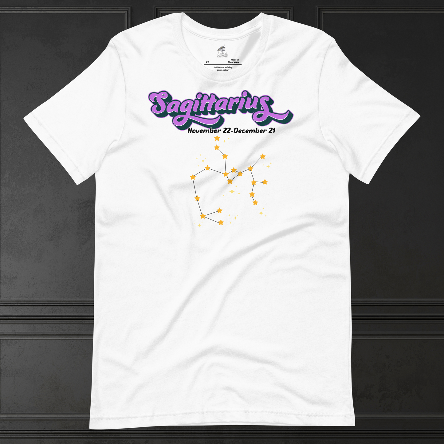 Front view of flat white men's Sagittarius Tee. This astrology T-Shirt has the word Sagittarius in large purple script shadowed in black for a 3-D effect. Below this it Says November 22-December 21. Under Sagittarius is the zodiac star constellation with yellow stars connected by a black line and lighter yellow smaller stars surrounding this. The perfect December or November Birthday Gift for him or yourself.