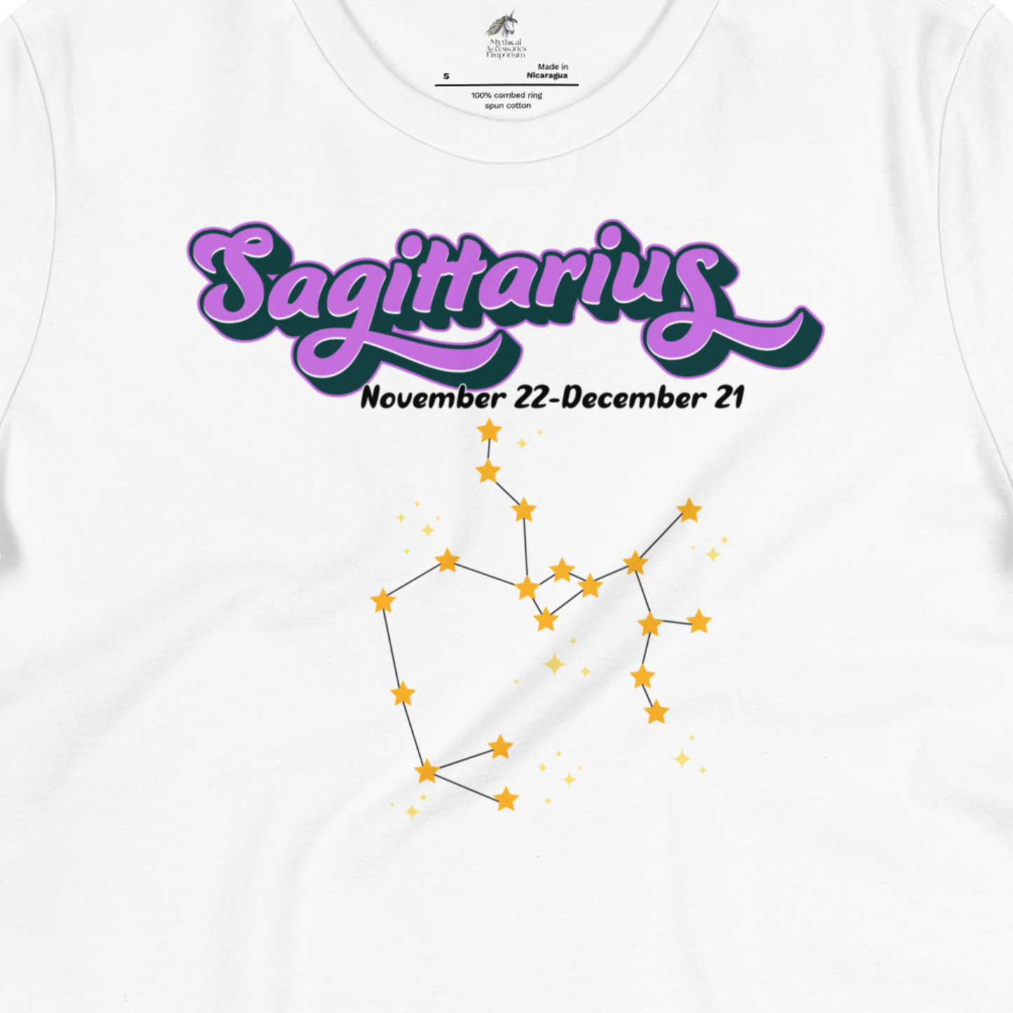 Up close view of front white women's Sagittarius Tee. This astrology T-Shirt has the word Sagittarius in large purple script shadowed in black for a 3-D effect. Below this it Says November 22-December 21. Under Sagittarius is the zodiac star constellation with yellow stars connected by a black line and lighter yellow smaller stars surrounding this. The perfect November or December Birthday Gift for her or yourself.