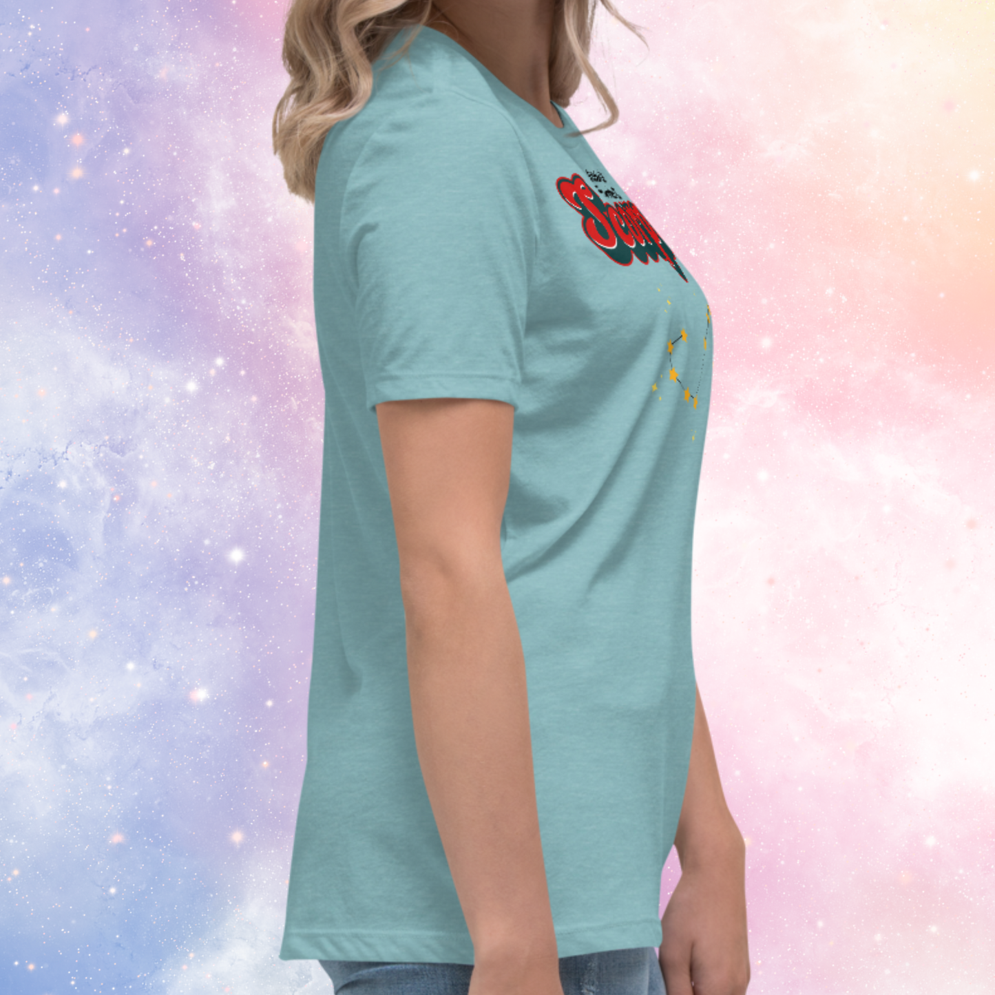 Right side view of model wearing Heather blue lagoon women's Scorpio Tee. You can see the sleeves are short and stop mid upper arm, you can see the hem falls at the hip of the model. The perfect October or November Birthday Gift for her or yourself.