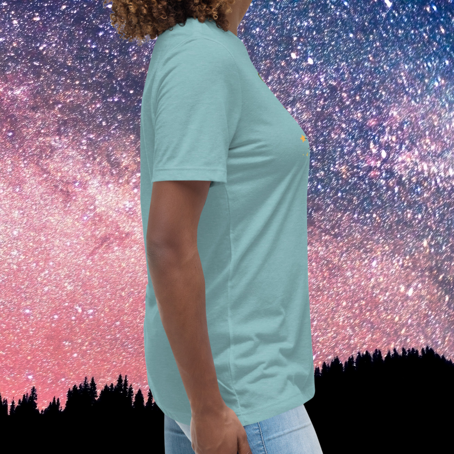 Right side view of model wearing heather blue lagoon women's Taurus Tee. Crew neck neckline and short sleeves going to mid upper arm, hem falls below hip. The perfect April or May Birthday Gift for Her or yourself.