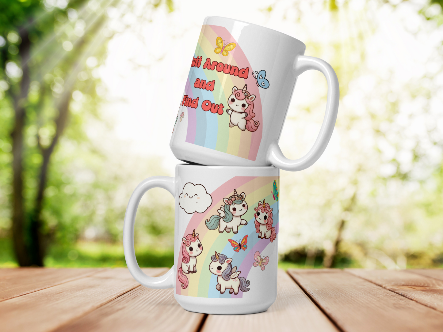 Sarcastic Unicorn Pegasus Rainbow ceramic 15 oz white mug. Two mugs stacked so that you can see each side of the mug. Top mug handle is to the right and you can see one end of the rainbow, a kawaii chibi unicorn with pink mane and tail. a blue and a yellow butterfly. The words "Fluff Around and Find Out" in pink bubble letters with a black outline.
