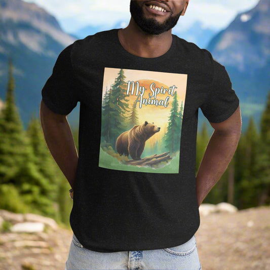 Men's My Spirit Animal Grizzly Bear T-Shirt. Front view black heather. Grizzly Bear paused in front of logs walking through the forest framed in a sunset. My Spirit Animal text at the top in white script.