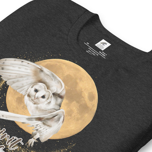 My spirit animal owl men's graphic tee, dark grey heather shirt front folded view, white owl flying against a harvest moon wings sparking a gold magical halo, mythical accessories emporium