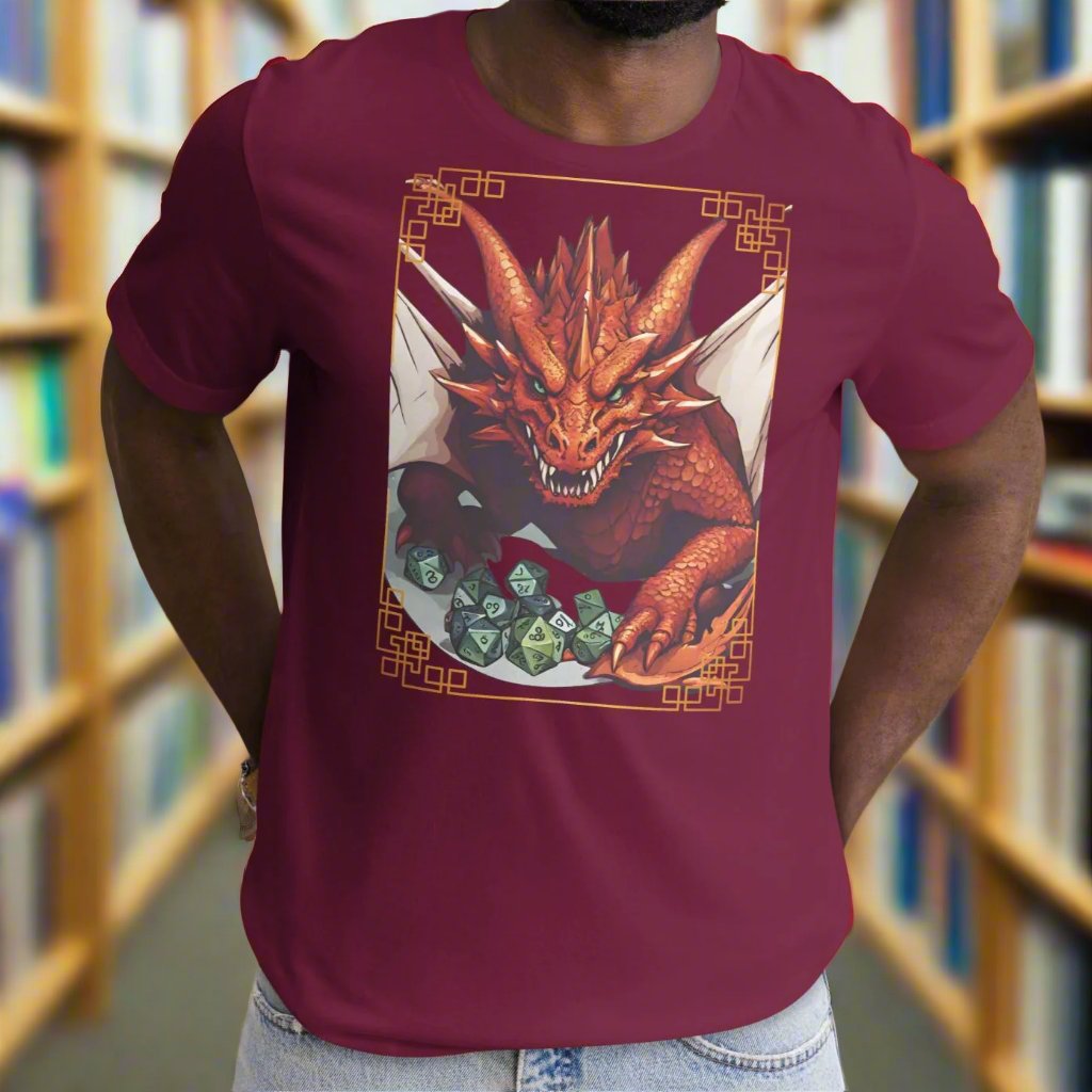 Front View Maroon Red Dragon DND Men's T-Shirt. Mens DND TShirt Dragon D20 Dice Graphic Tee. Red Dragon bordered in red gold stalking towards over a pile of D20 dice.