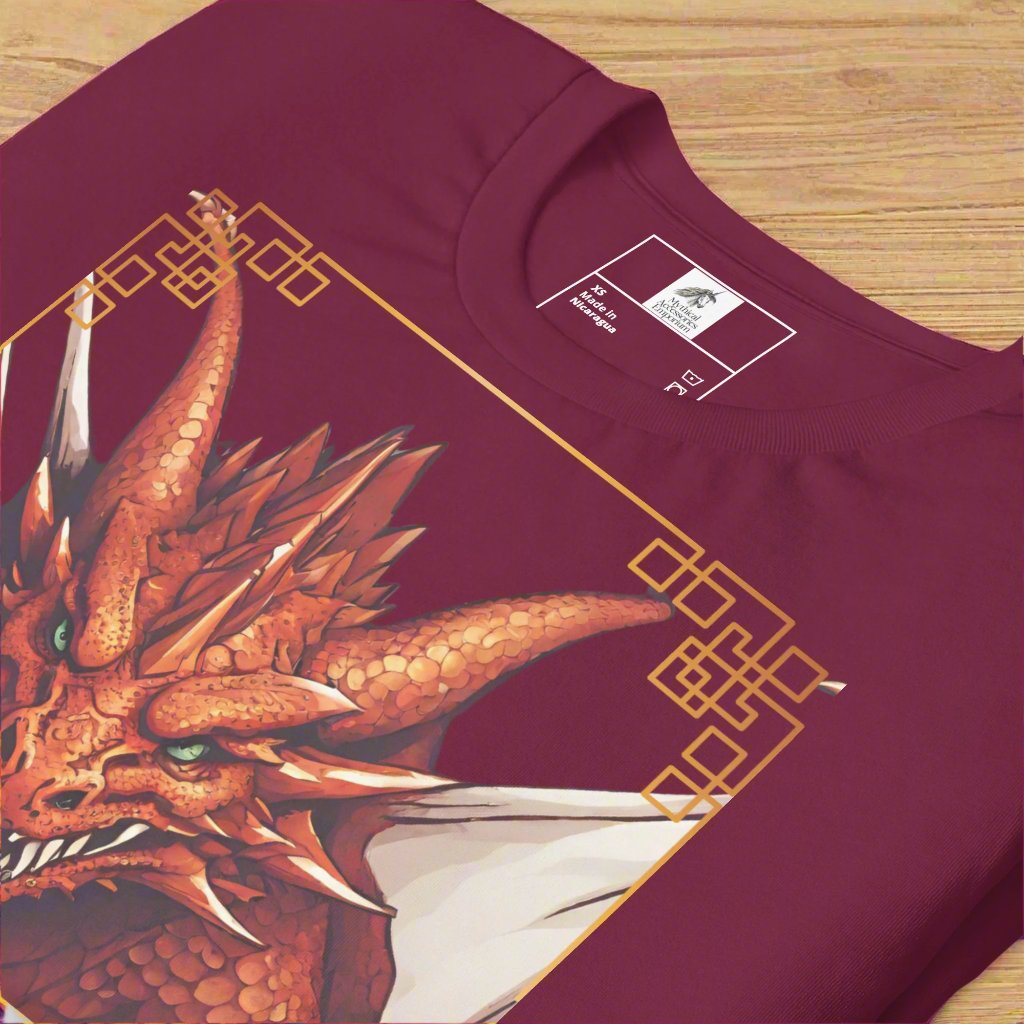 Front View up close of maroon shirt Red Dragon DND Men's T-Shirt. Mens DND TShirt Dragon D20 Dice Graphic Tee. Red Dragon bordered in red gold stalking towards over a pile of D20 dice.
