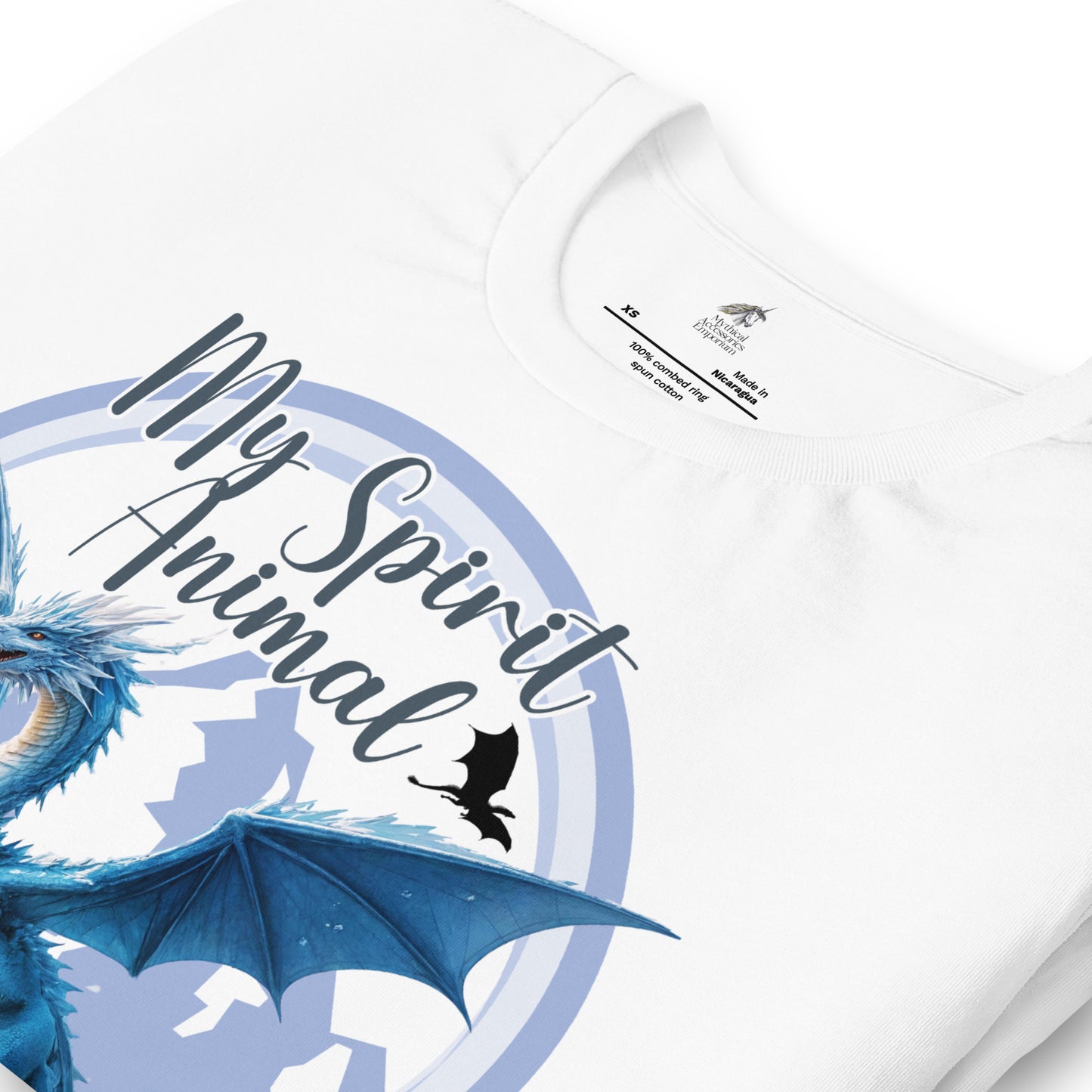 My Spirit Animal Dragon men's Graphic Tee, front view folded white shirt, Blue Ice Dragon with wings spread standing in front of snow capped mountain range with a dragon silhouette flying above within a blue grey circle