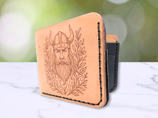 Handmade Viking Wallet in veg tan leather. Front view standing on bottom slightly open to see a small amount of the interior black leather card pockets.