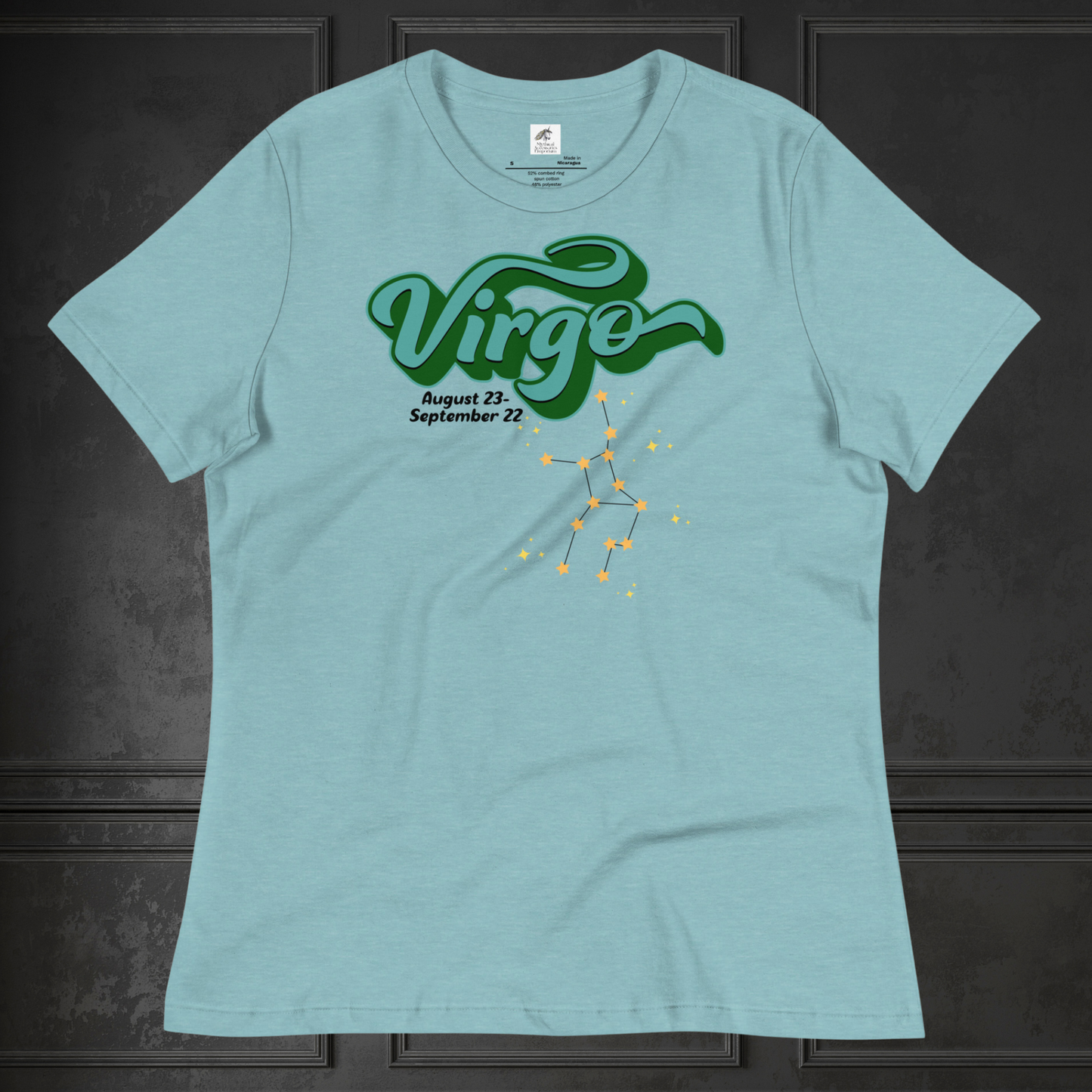 Front view of flat Heather blue lagoon women's Virgo Tee. This astrology Virgo T-Shirt has the word Virgo in large turquoise script shadowed in deep green for a 3-D effect. Below this it Says August 23-September 22. Under Virgo is the zodiac star constellation with yellow stars connected by a black line and lighter yellow smaller stars surrounding this. The perfect August or September Birthday Gift for Her or yourself.