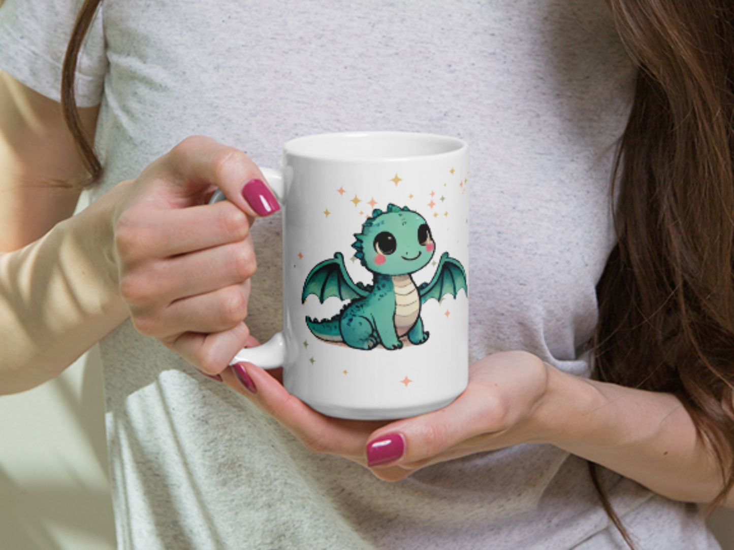 Dragon mug with handle to the left held by a woman. Light green kawaii dragon with widespread wings and rosy cheeks looking up amidst magic stars. DND Dragon Lover's Gift for Fantasy Readers