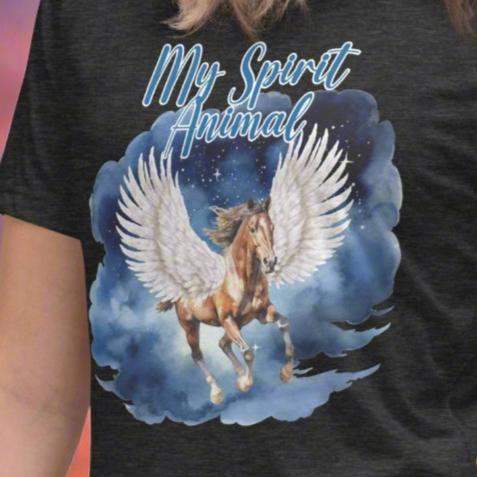 Close UP My Spirit Animal Women's Graphic Tee, Pegasus white feathered wings on a Pinto with a dark brown mane and tail, galloping through the sky against a background of clouds and stars. Mythical Accessories