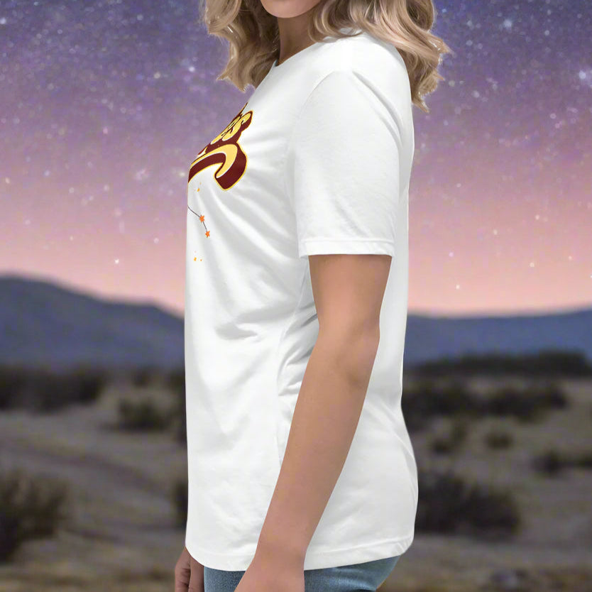 Woman wearing a white t-shirt facing to the left side. You can see this side of the sleeve and seam going down the side of the shirt under arm. Aries constellation zodiac astrology sign.