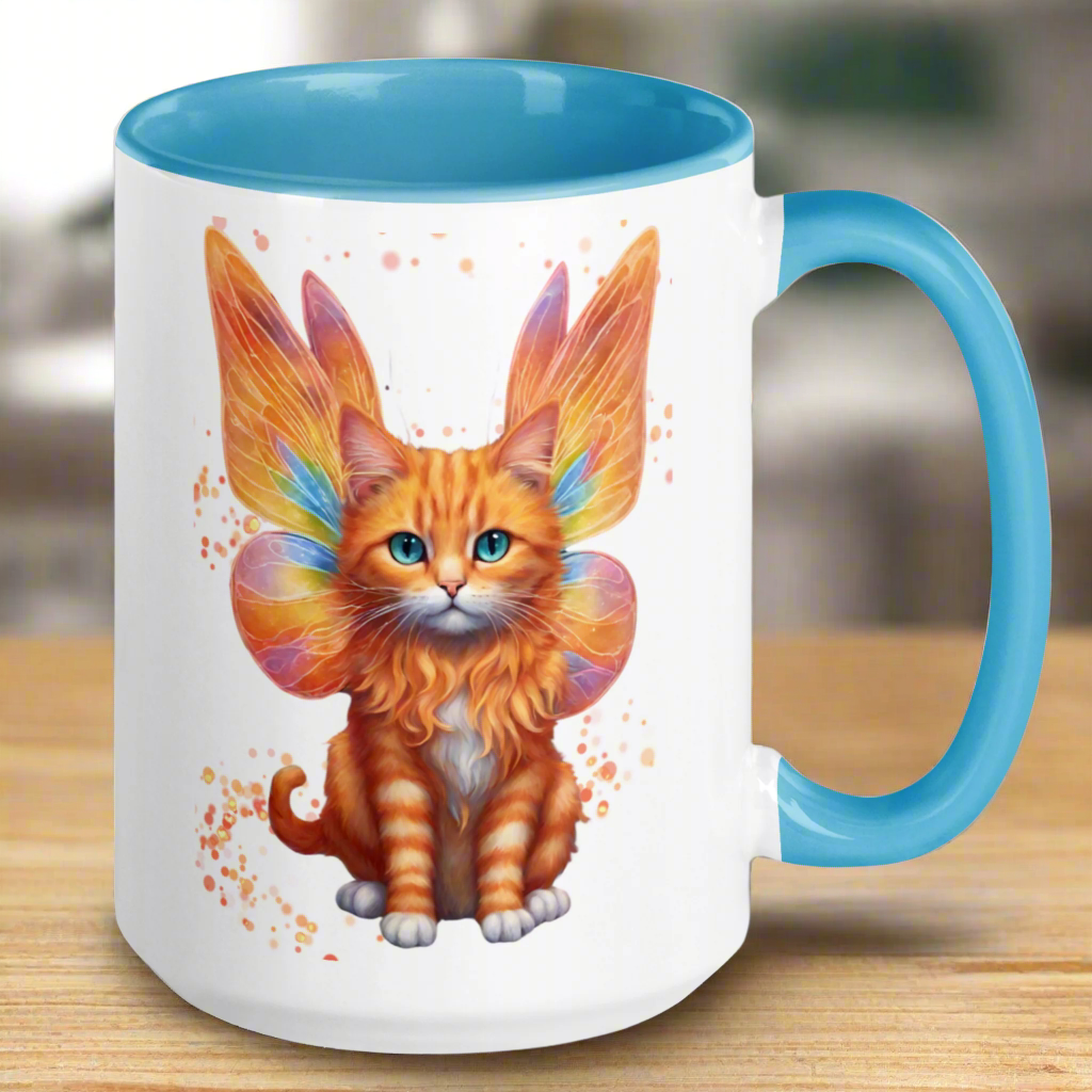 Ceramic Mug with blue interior and handle view is to the right. Orange tabby striped Fairy Cat on both sides of Mug, Cat features orange wings with hints of blue and pink