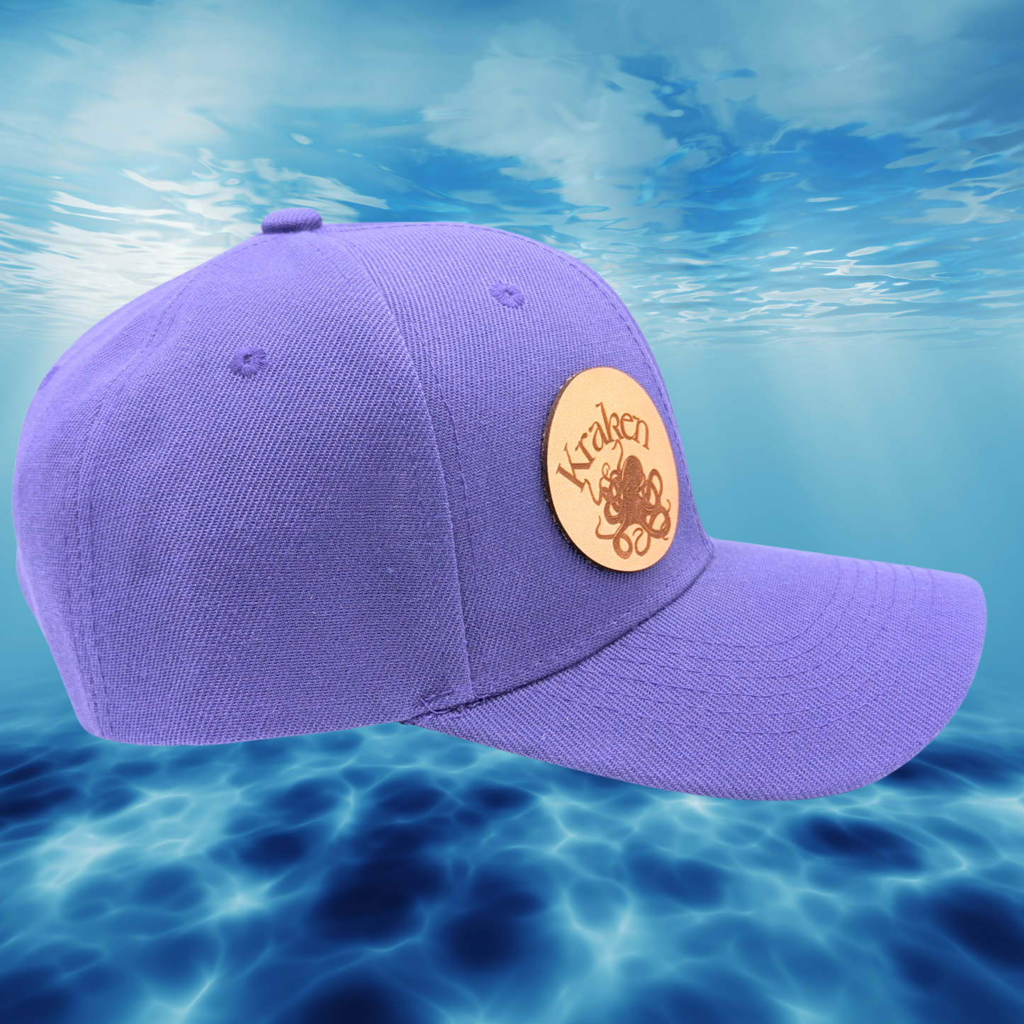 Right View purple Hat. Laser Engraved Leather Patch Text Kraken curved above the image of a Kraken. Kraken Viking Hat 