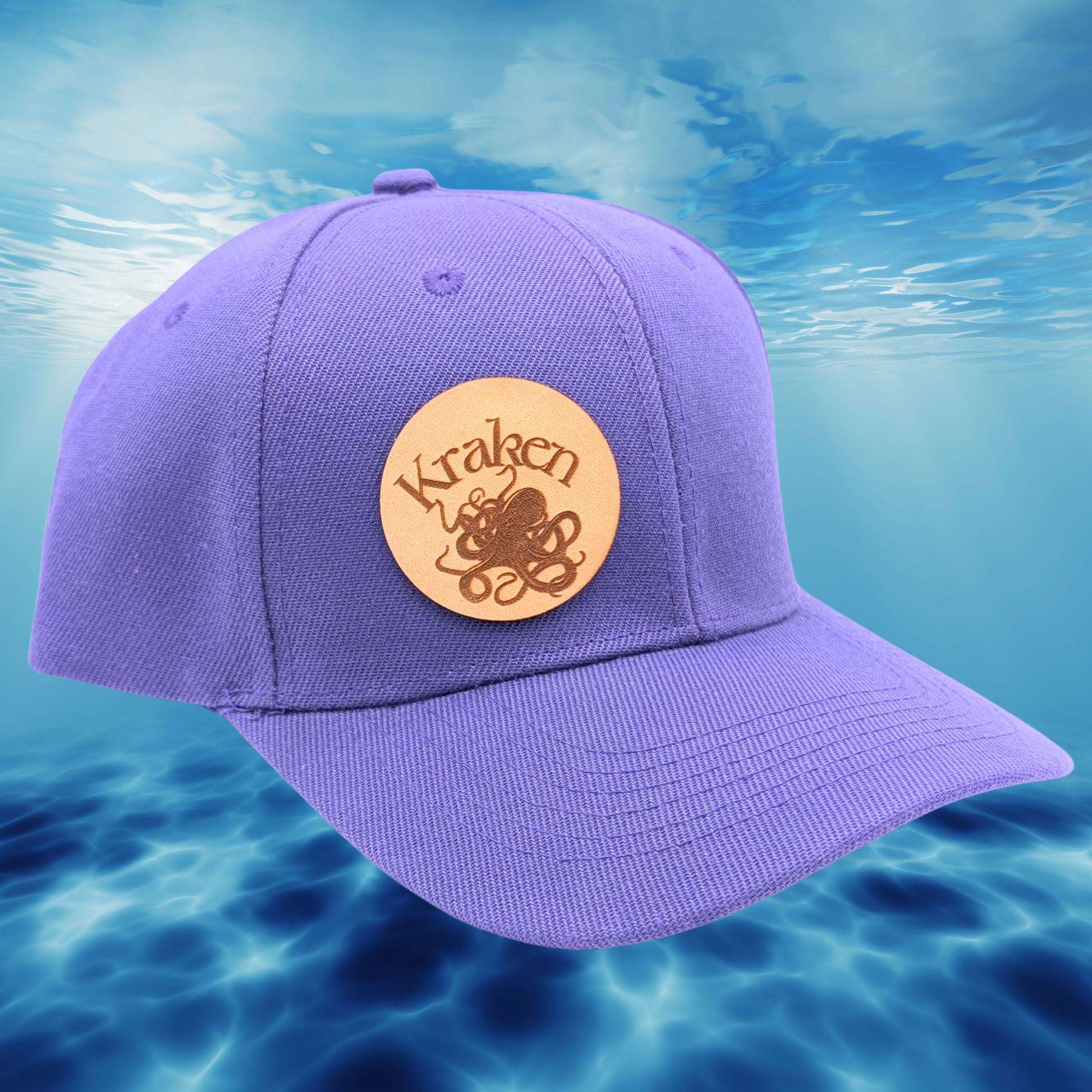 Front Right View purple Hat. Laser Engraved Leather Patch Text Kraken curved above the image of a Kraken. Kraken Viking Hat 