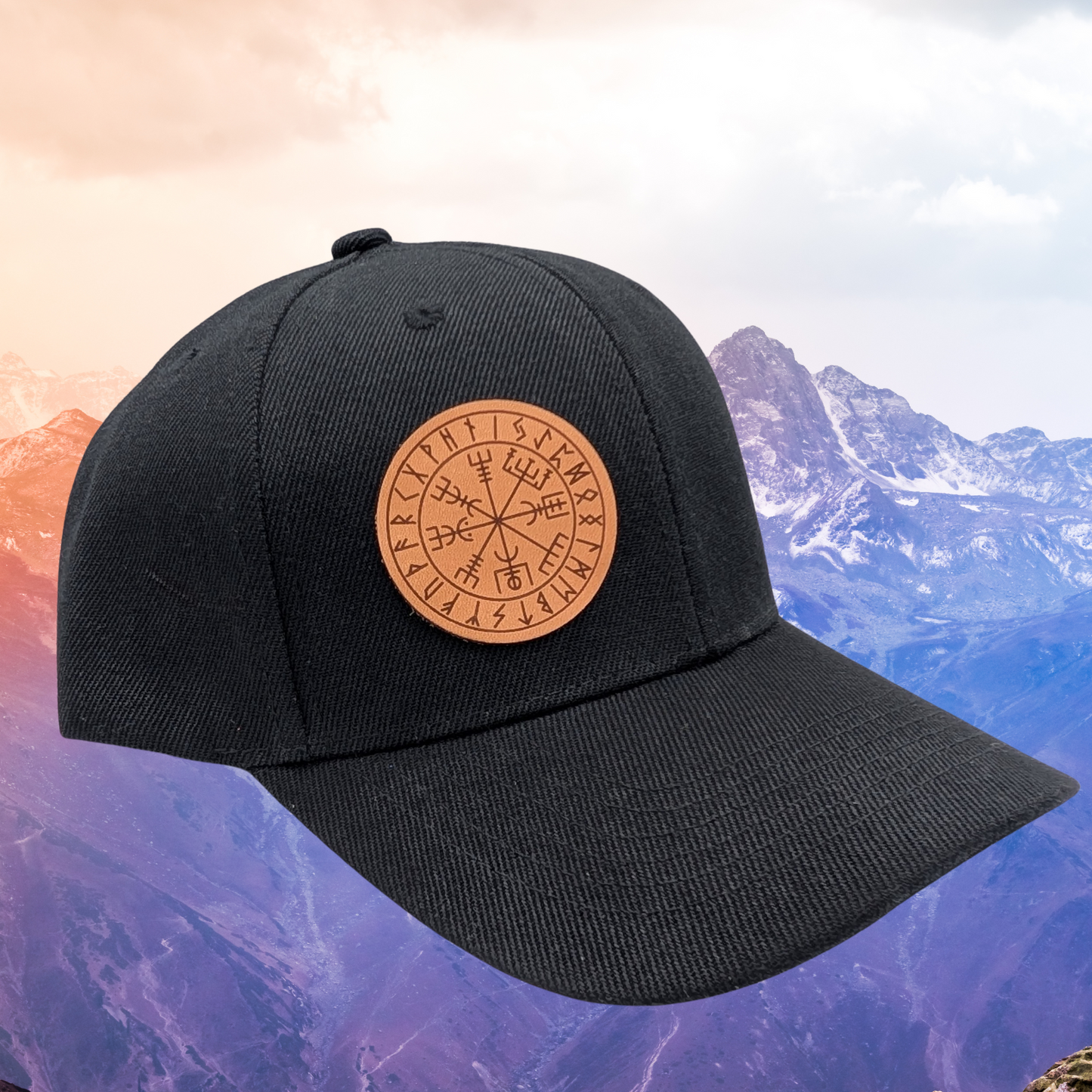 Viking Rune Wayfinder Vegvisir Snapback Hat. Front right side view of hat. On the right front of the hat is a round leather patch. On the leather patch is a laser engraved image of the viking compass also known as Wayfinder or Vegvisir. This is a rune of protection and not losing one's way.