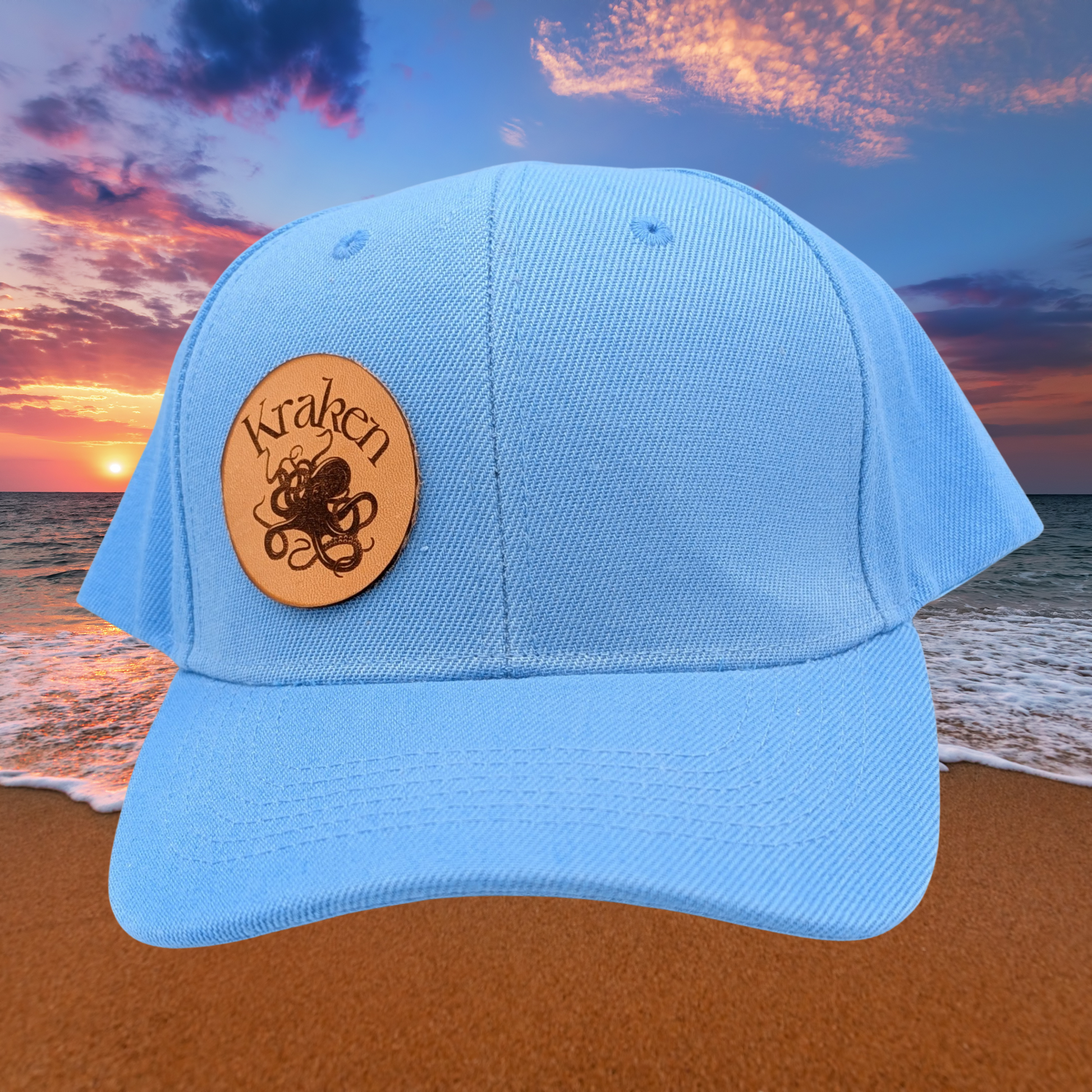 Front View Light Blue Hat. Laser Engraved Leather Patch Text Kraken curved above the image of a Kraken. Kraken Viking Hat 