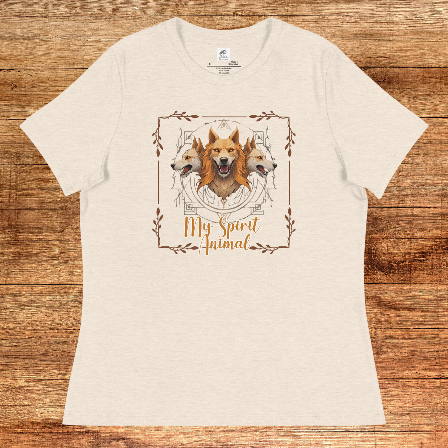 My Spirit Animal Cerberus Women's Graphic Tee,flat front View heather prism natural t shirt. A three headed guardian of the underworld in golden browns with jaws open to display canines. Below the hellhound is my spirit animal