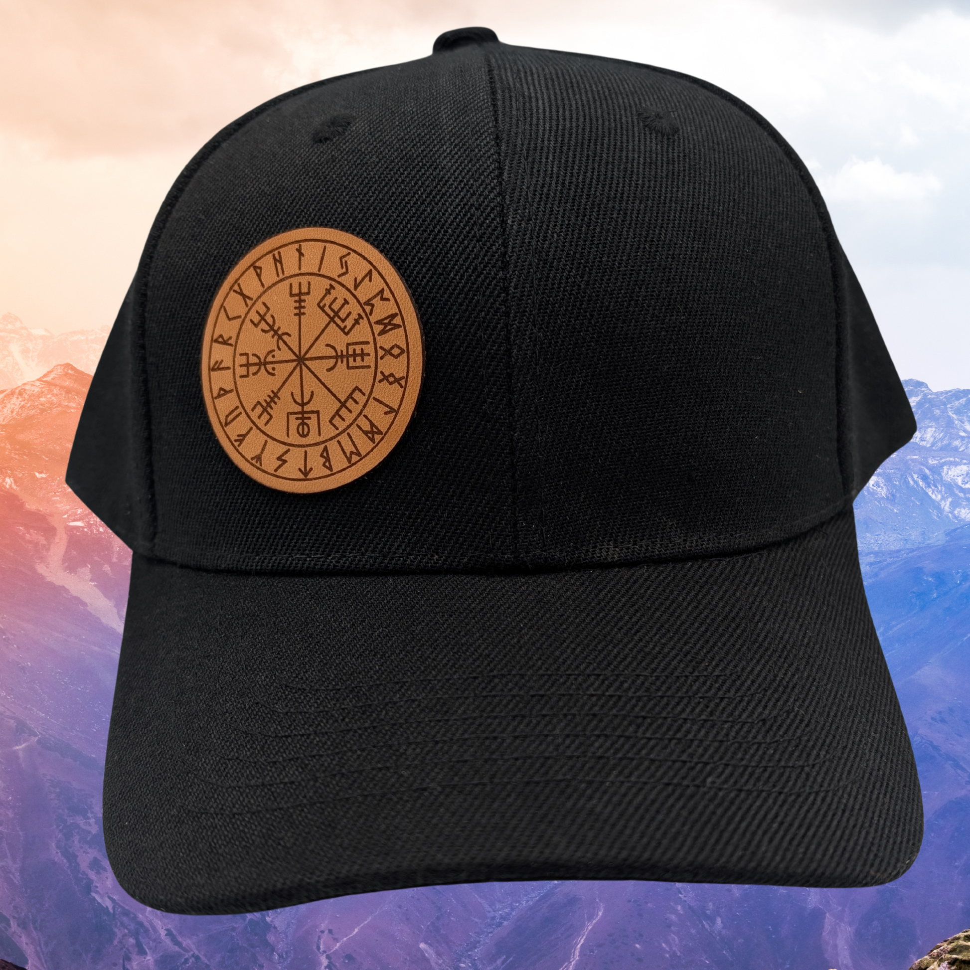 Viking Rune Wayfinder Vegvisir Snapback Hat. Front side view of hat. On the right front of the hat is a round leather patch. On the leather patch is a laser engraved image of the viking compass also known as Wayfinder or Vegvisir. This is a rune of protection and not losing one's way.