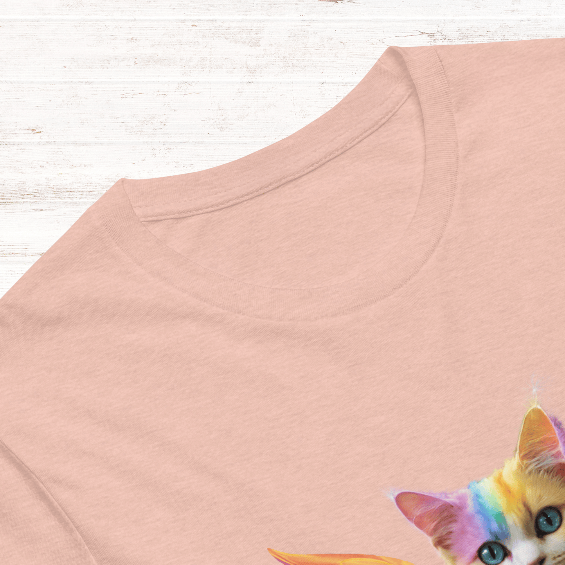 peach Front View Men's T-Shirt laying flat on a white wooden surface, Rainbow Colored Tie Dye Cat with bright orange gold wings. Pop Art Cat, Fantasy Art, Fairycore Cat TShirt gifts for cat lover and cat dad shirt, whimsical fantasy magic rainbow fairy cat