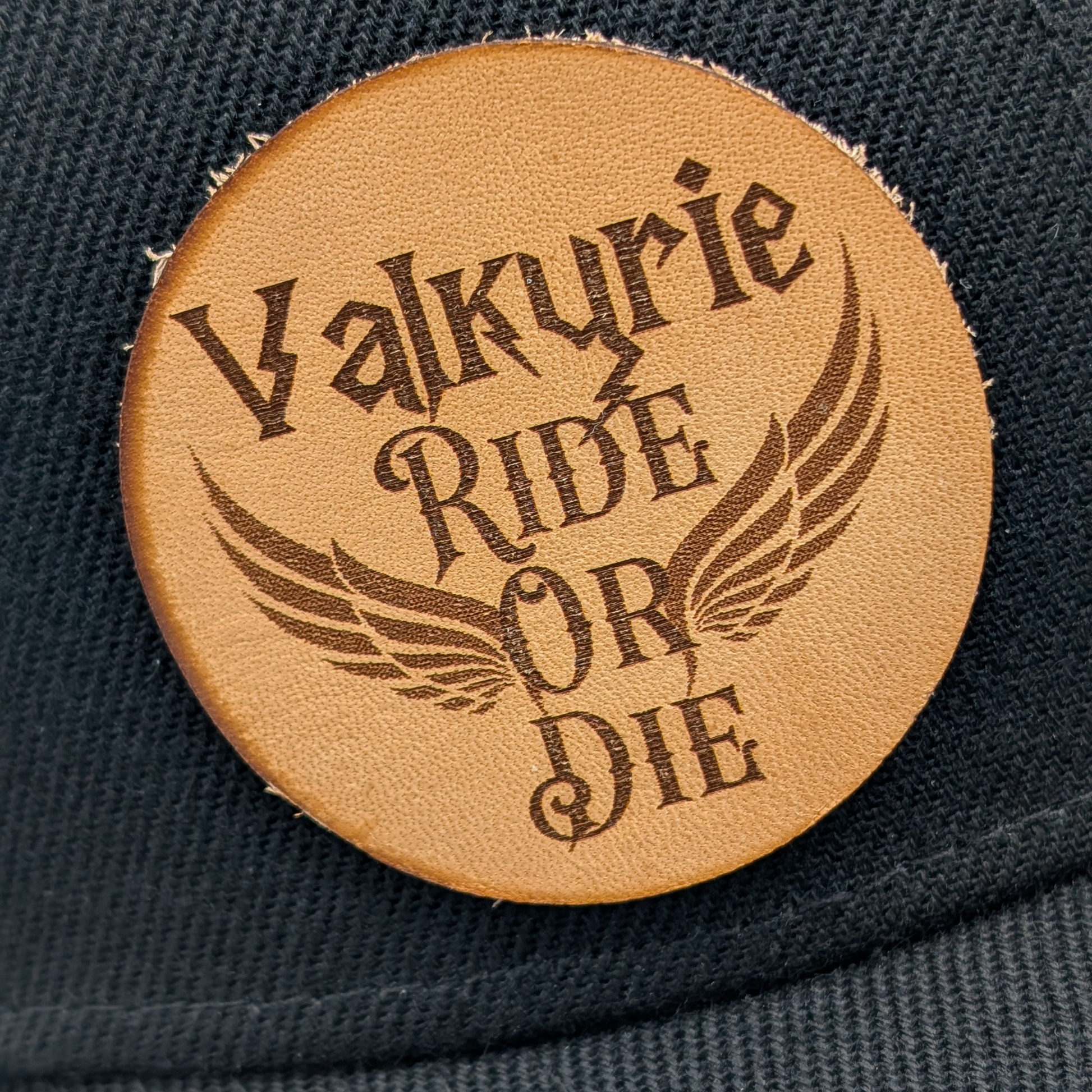 Up close view of the leather patch is laser engraved with Valkyrie Ride Or Die. From the word Or wings spread out to both sides. Valkyrie Warrior Viking Hat