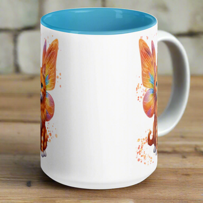 Ceramic Mug with blue interior and handle view is from the opposite side from the handle. Orange tabby striped Fairy Cat on both sides of Mug, Cat features orange wings with hints of blue and pink